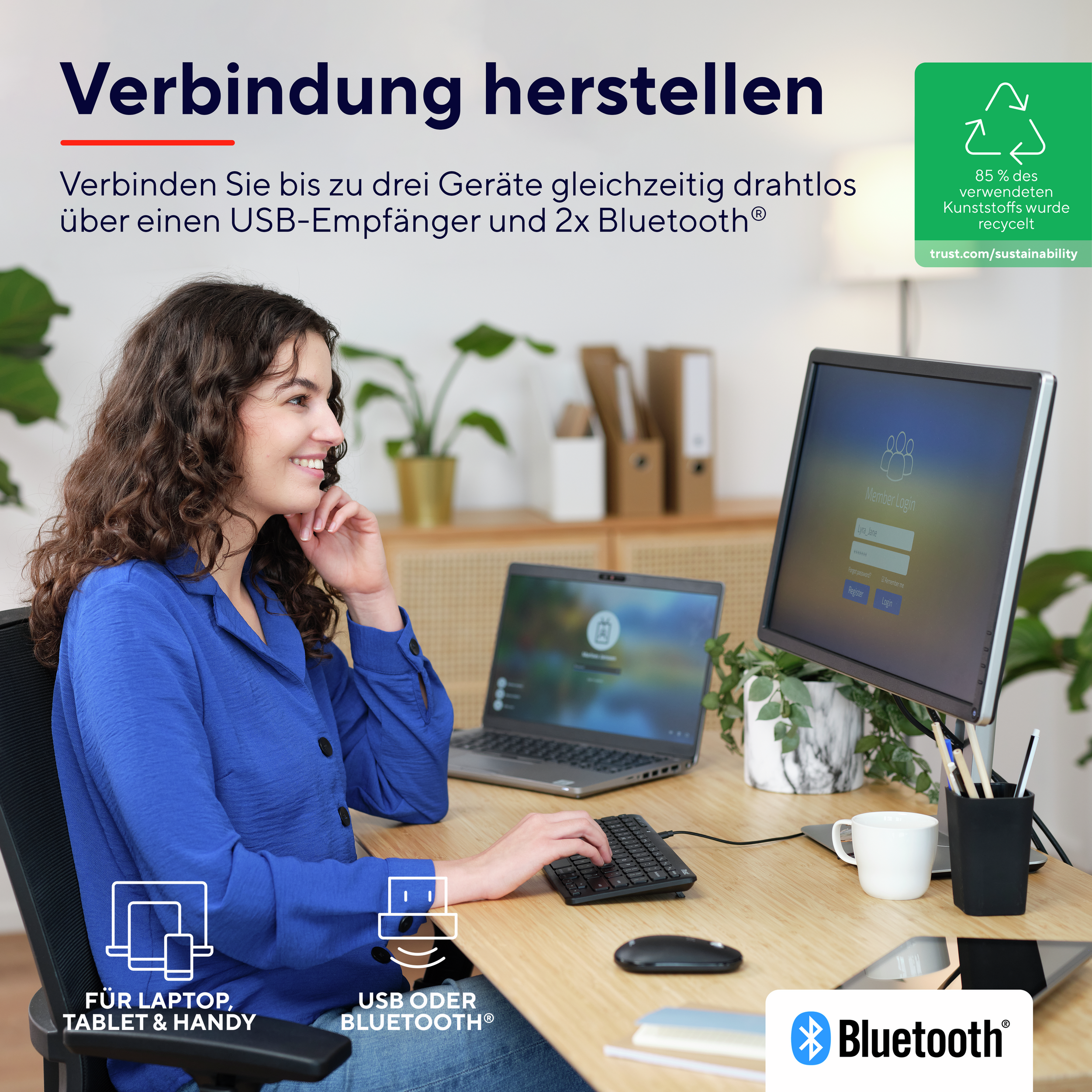 Kobieta przy biurku używająca laptopa i monitora, z logo Bluetooth i USB.