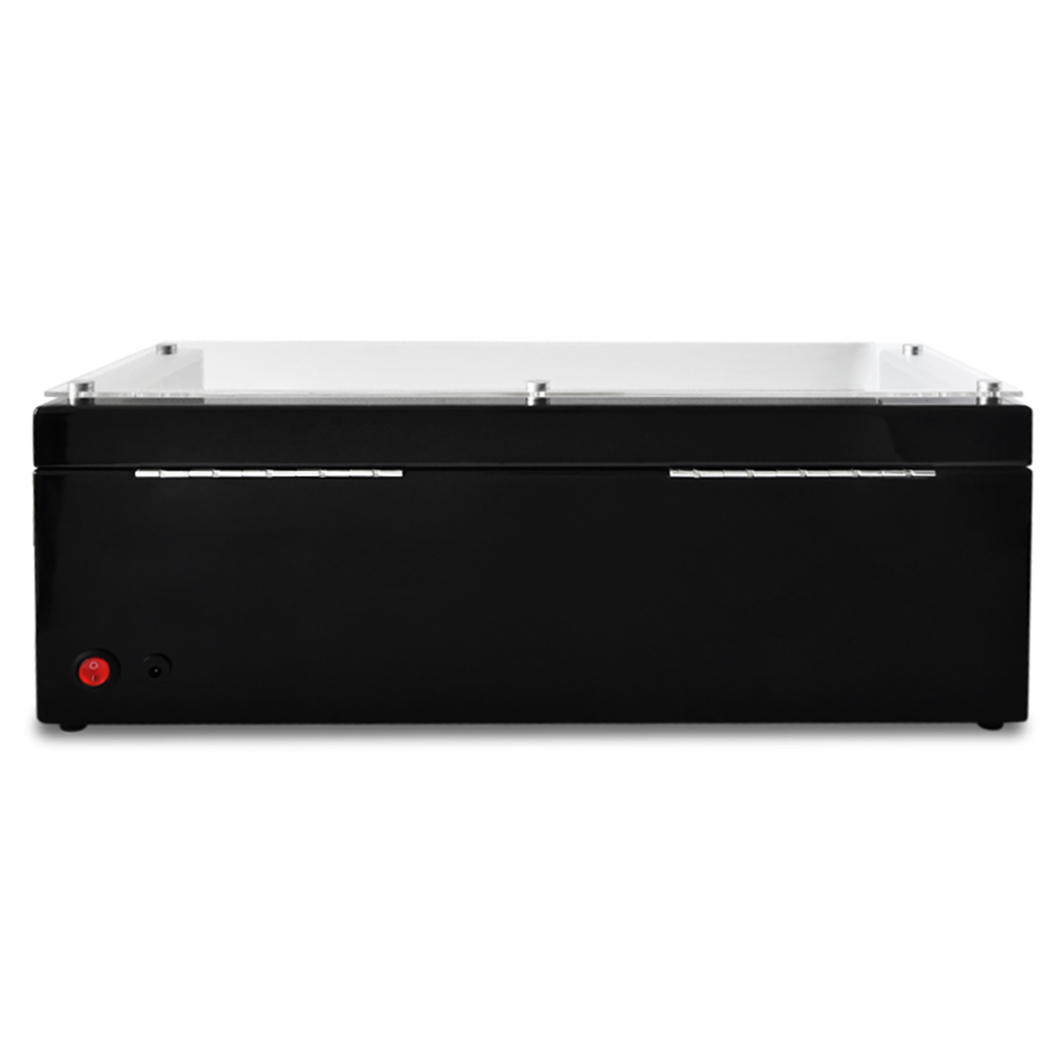 Ein schwarzes, rechteckiges Gerät mit transparentem Deckel. Es hat einen Power-Knopf und ein rotes Licht.