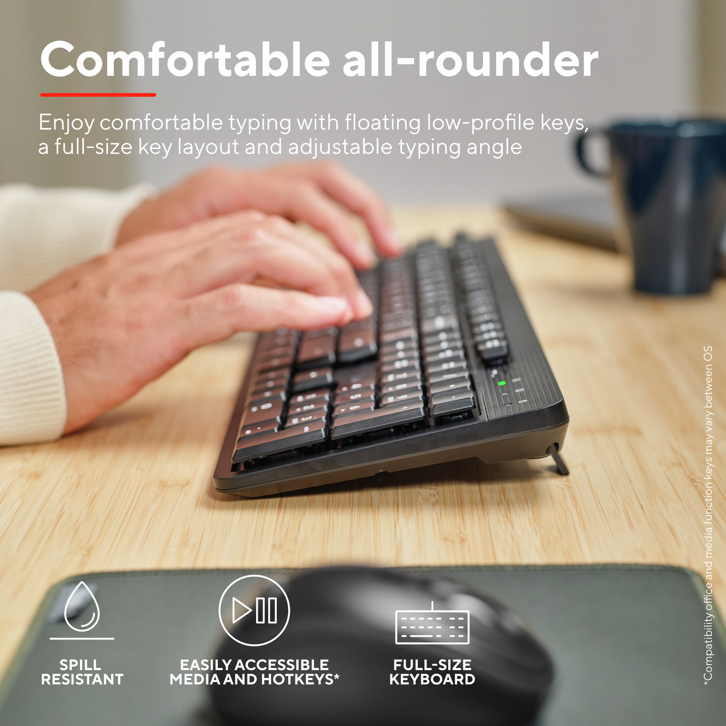 Osoba pisząca na czarnej klawiaturze z klawiszami multimedialnymi, myszą i podkładką.