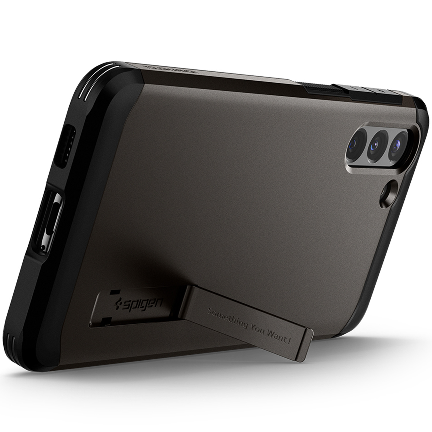 Zwarte telefoonhoes met kickstand. Grijze achterkant en het merk Spigen. De kickstand zegt "Something You Want!"