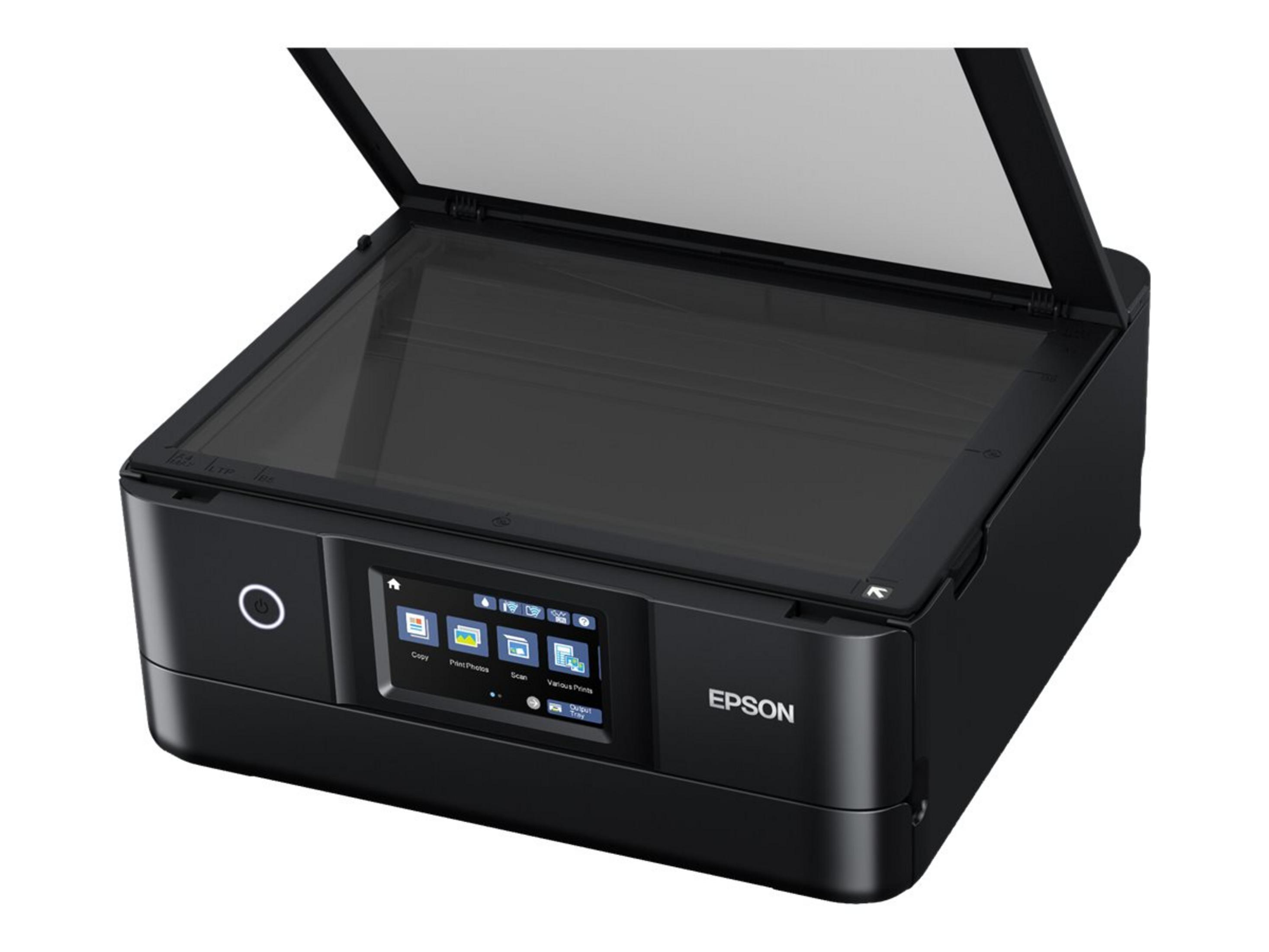 Czarna drukarka Epson z otwartą pokrywą, panelem sterowania i białym tłem.