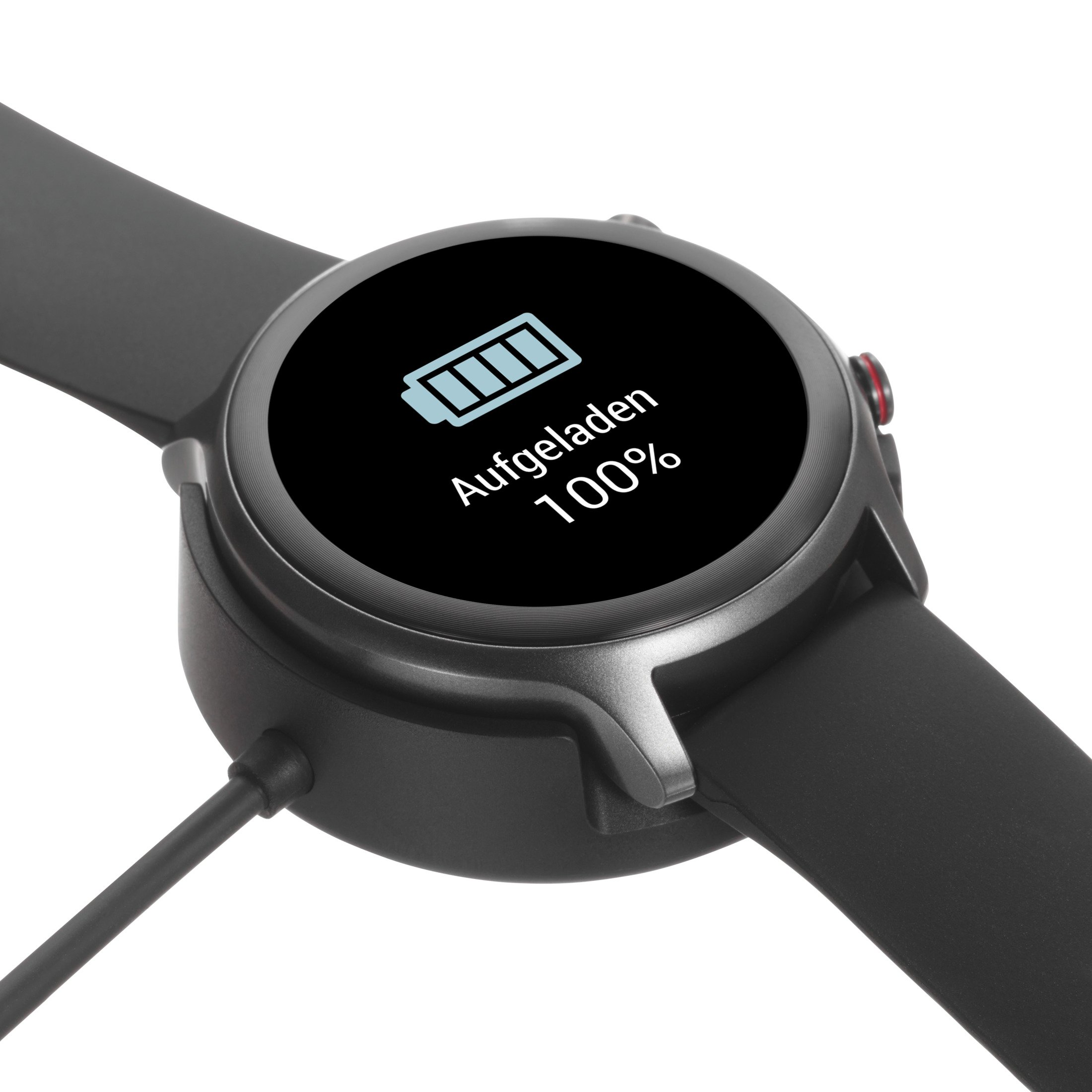 A black smartwatch charging, showing 100% charged on the screen.