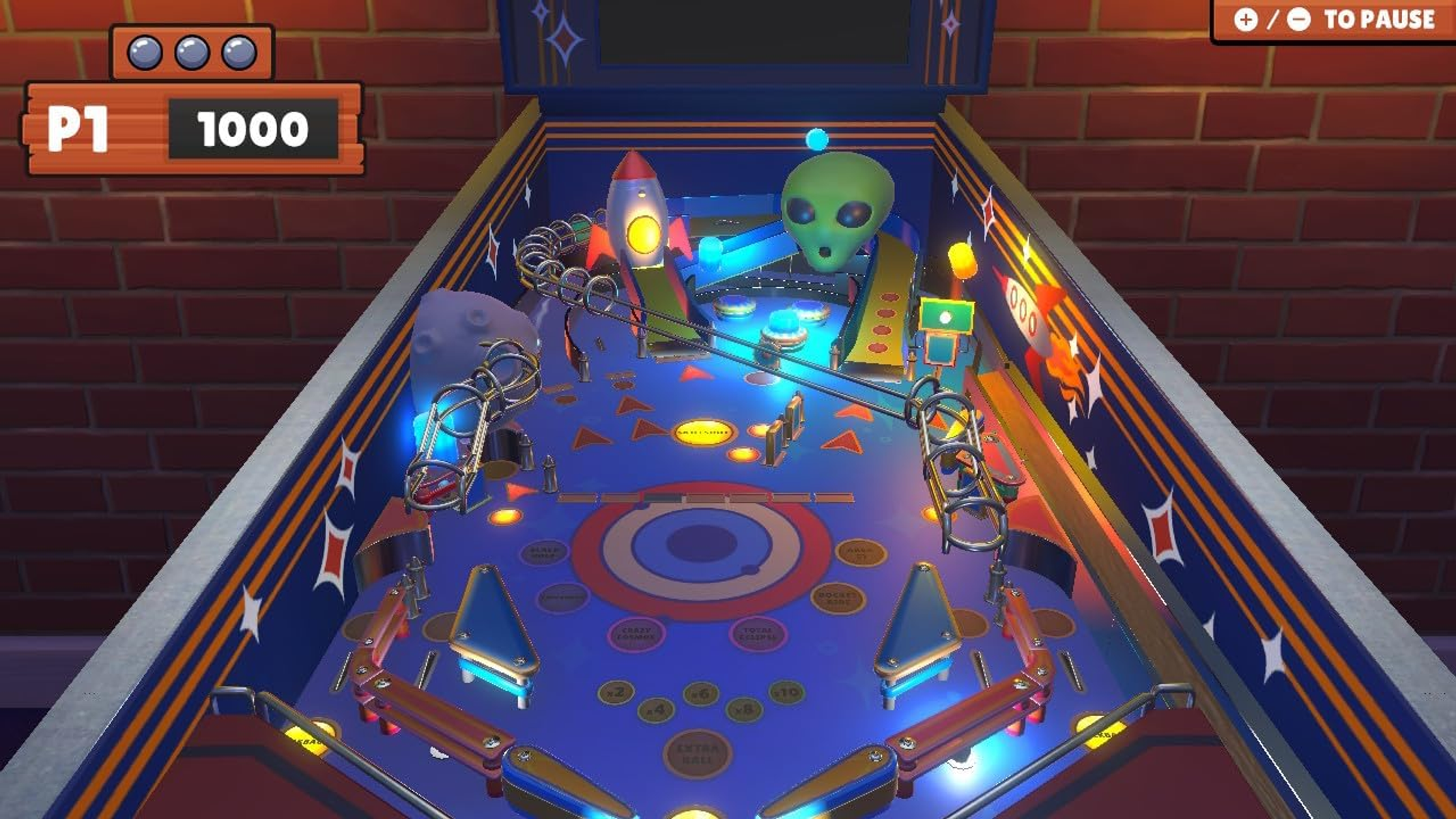Pantalla de juego de pinball. El juego muestra una máquina de pinball con un cohete y un alienígena.