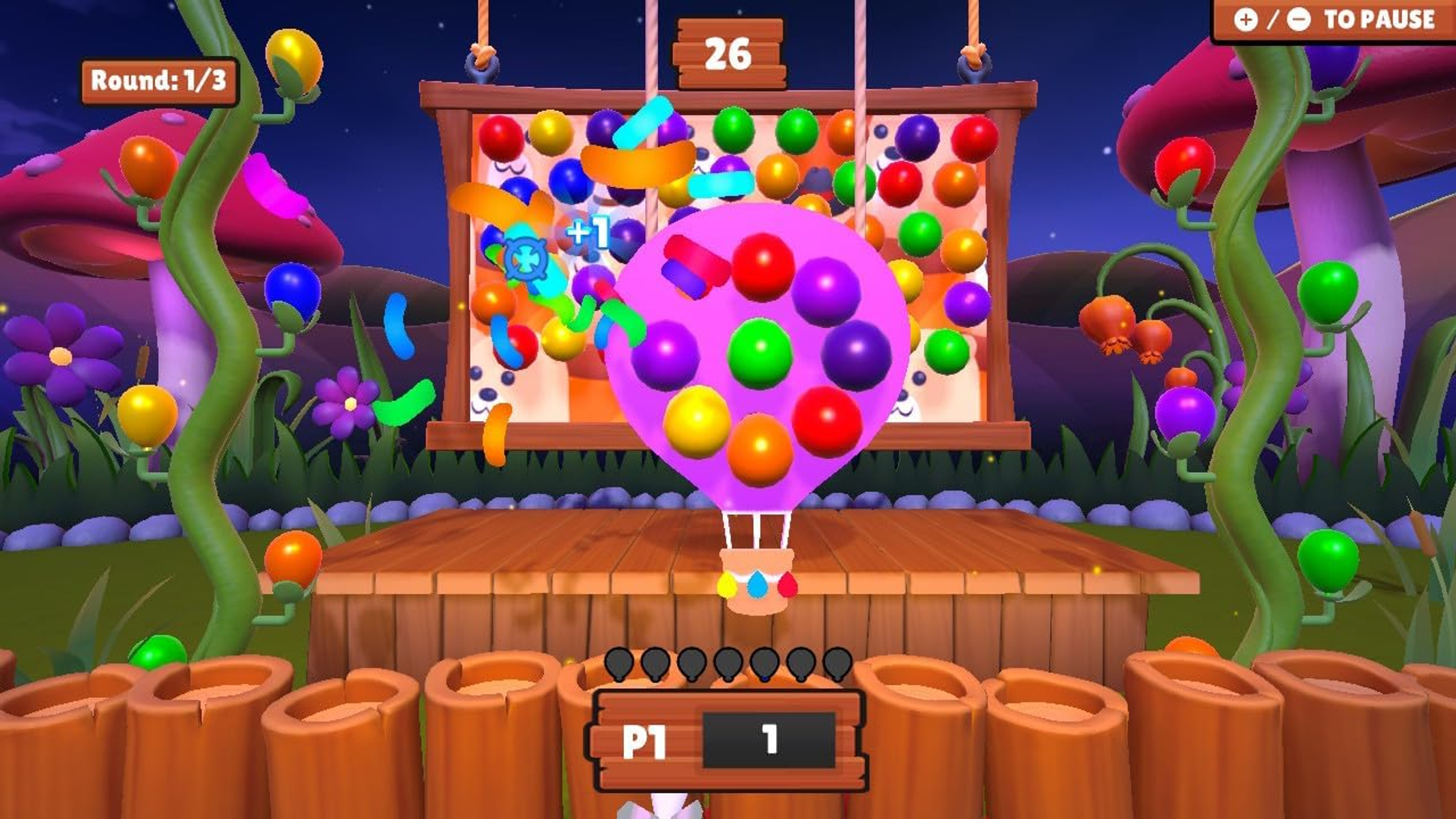 Captura de pantalla de un juego móvil con globos y objetos coloridos.