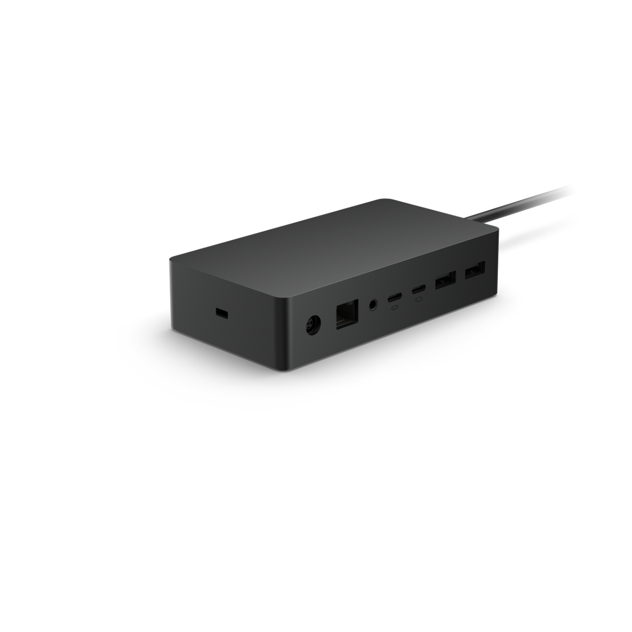 Estación de acoplamiento negra con múltiples puertos, sobre una superficie blanca. Un cable conectado.