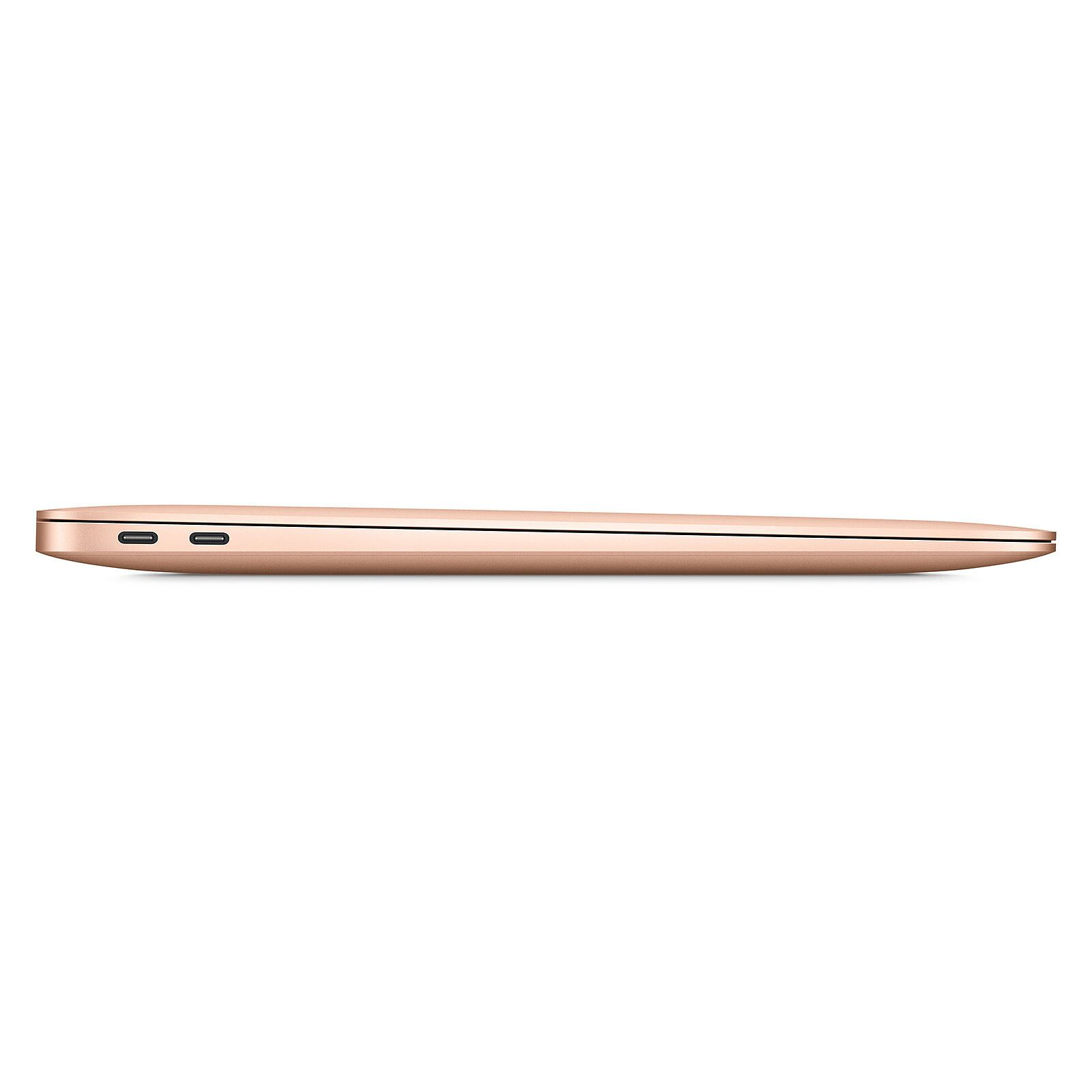 Un perfil lateral de una computadora portátil dorada sobre un fondo blanco.
