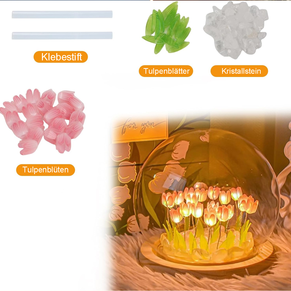 Eine Auswahl an Bastelmaterialien: Klebestifte, Tulpenblätter, Kristalle und Tulpenblüten in einer Glasglocke.