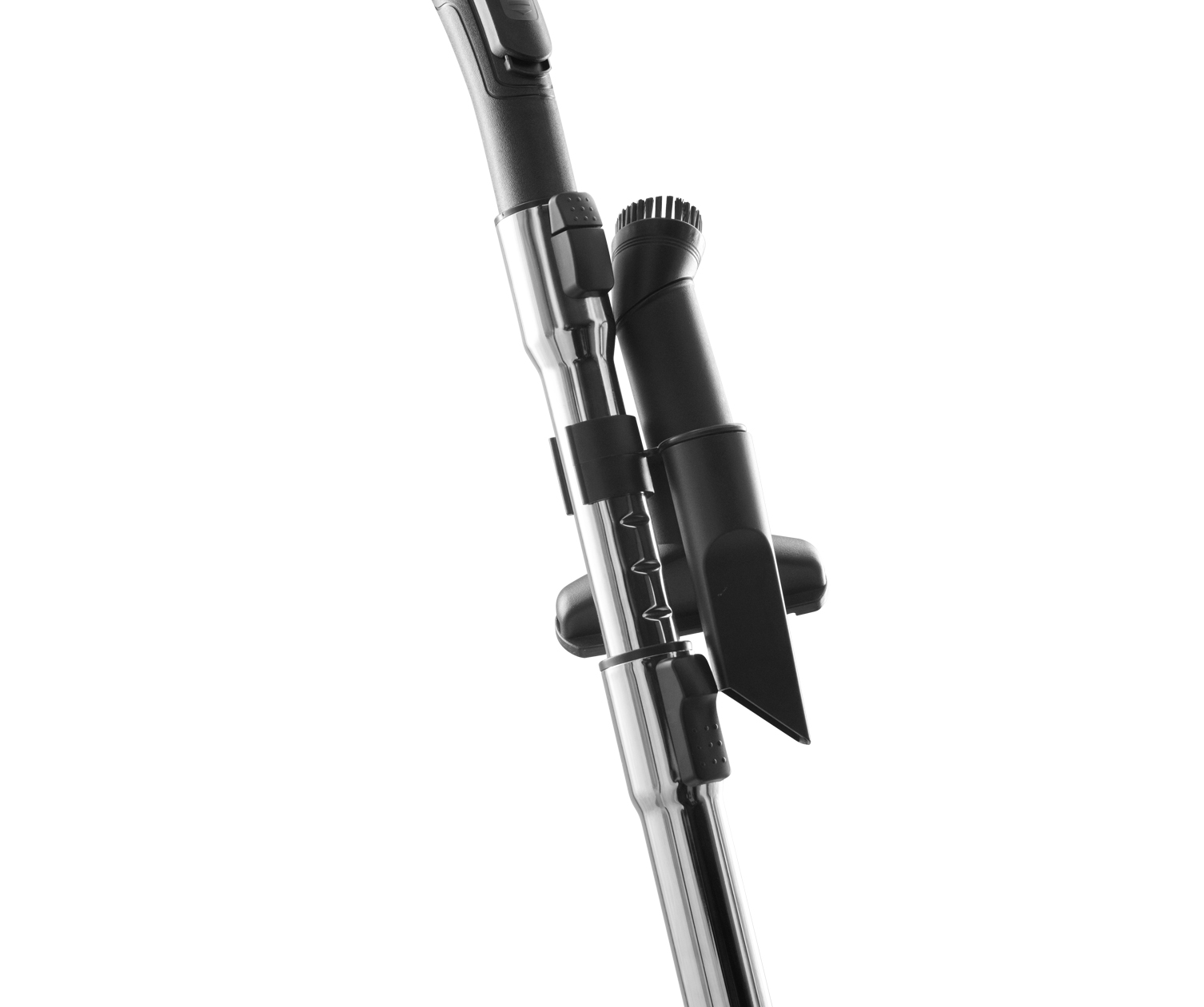 Vacuum cleaner attachments, including a brush and crevice tool, against white.