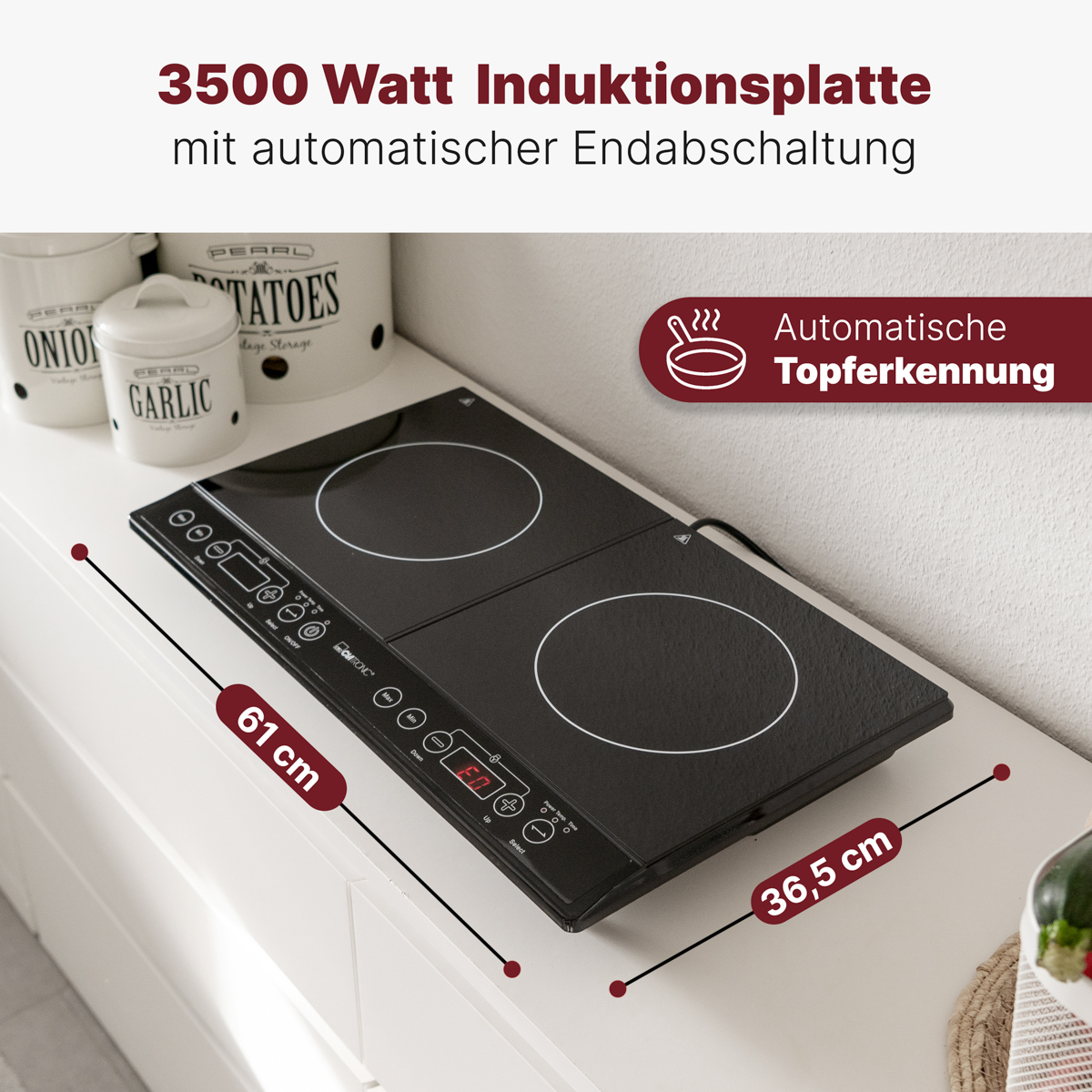 Czarna płyta indukcyjna na białej powierzchni. Dwie strefy gotowania. Tekst: 3500W, 61 cm, 36,5 cm.