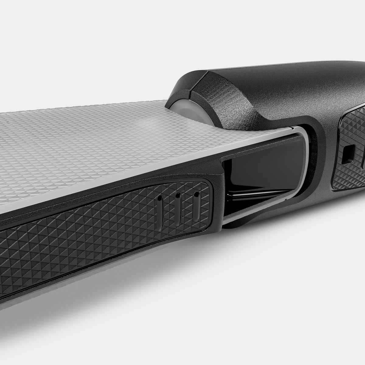 Zbliżenie czarnego szczegółu urządzenia.