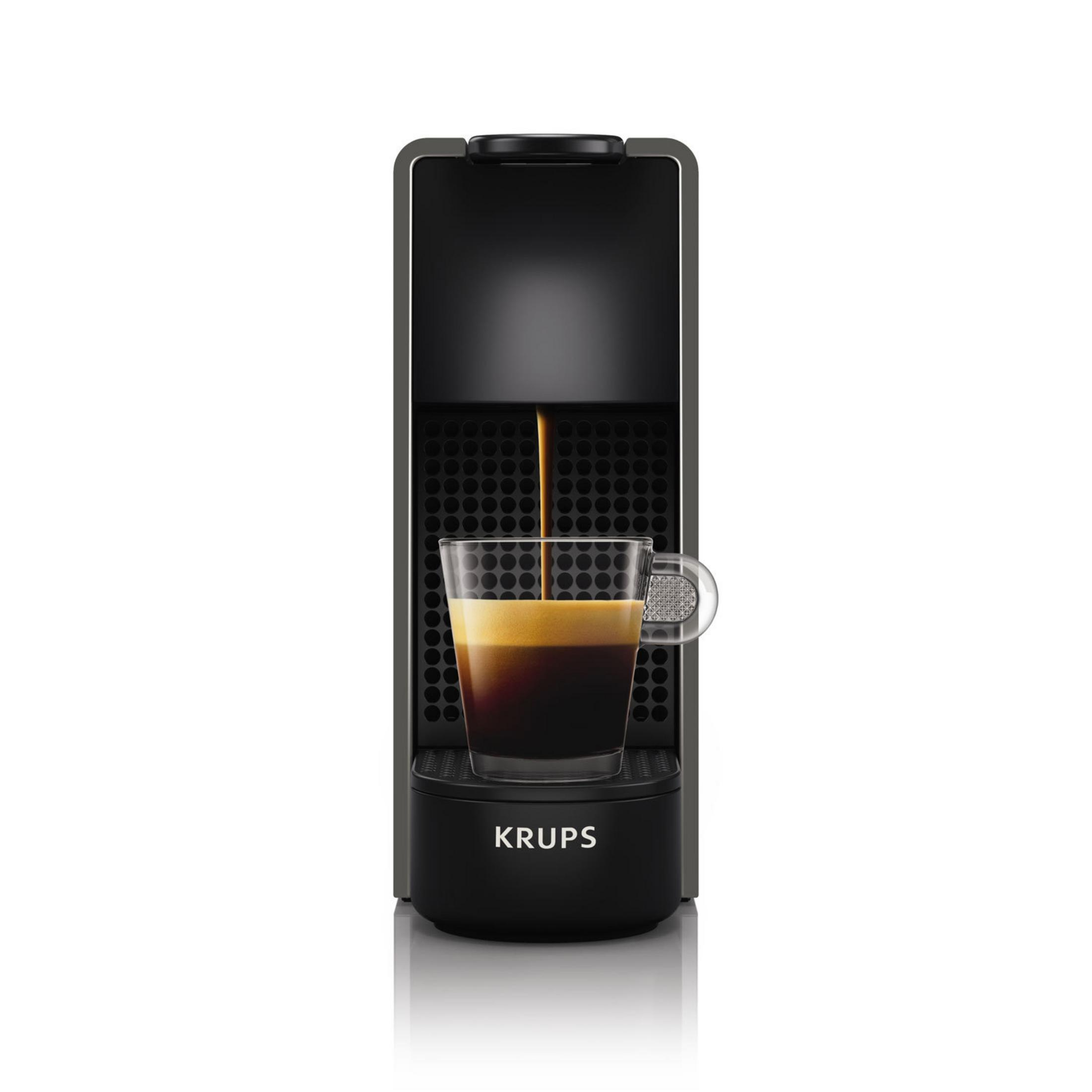 Ekspres do kawy. Czarny. Nalewa kawę do szklanki. Logo Krups.