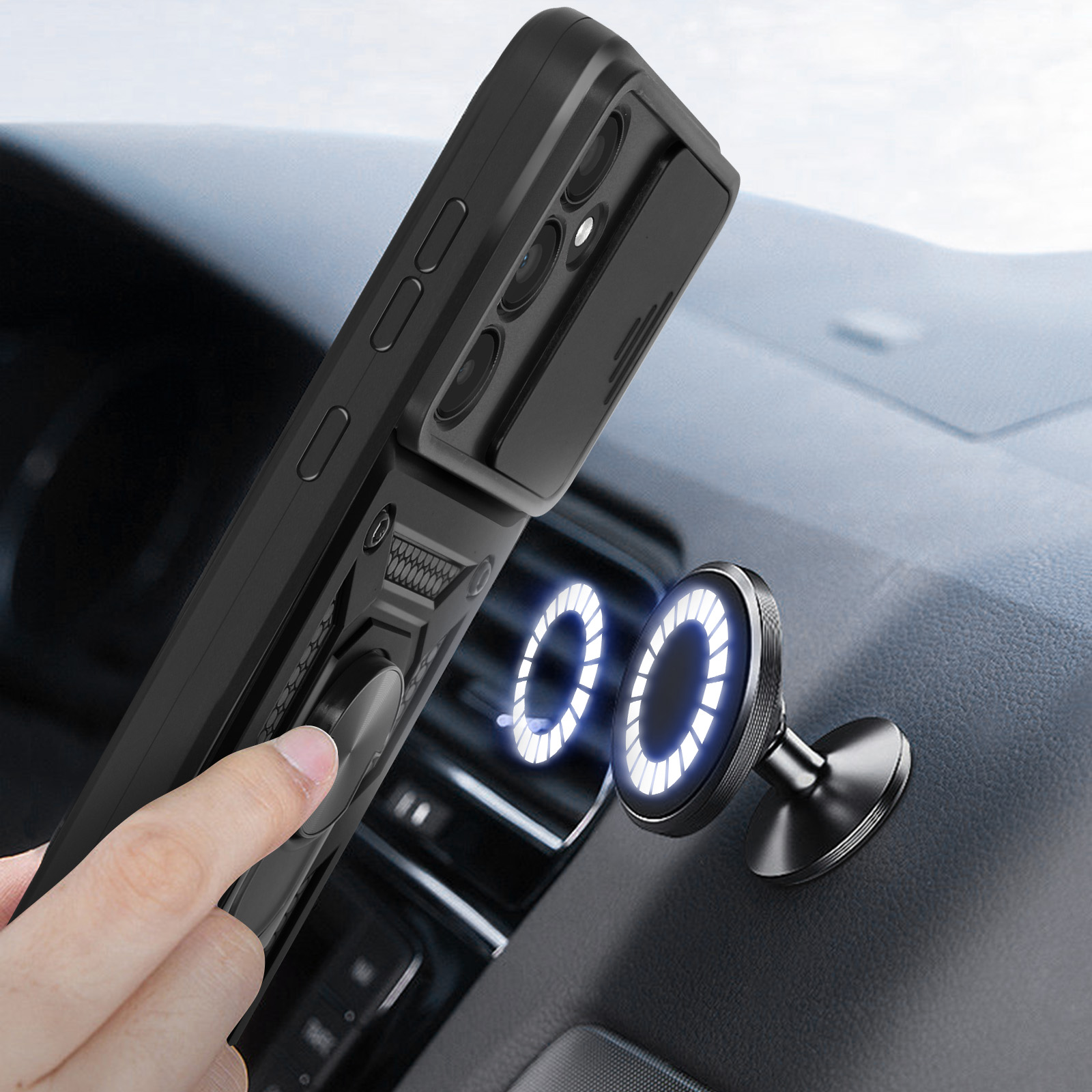 Una custodia nera con un supporto ad anello attaccata al cruscotto di un'auto con un supporto magnetico.