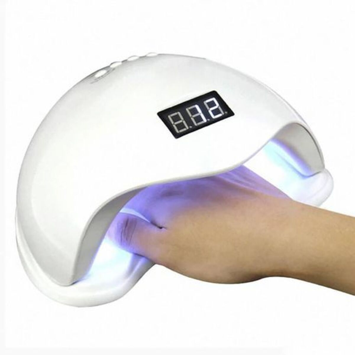 Una lámpara de uñas blanca con una mano dentro, con pantalla digital.