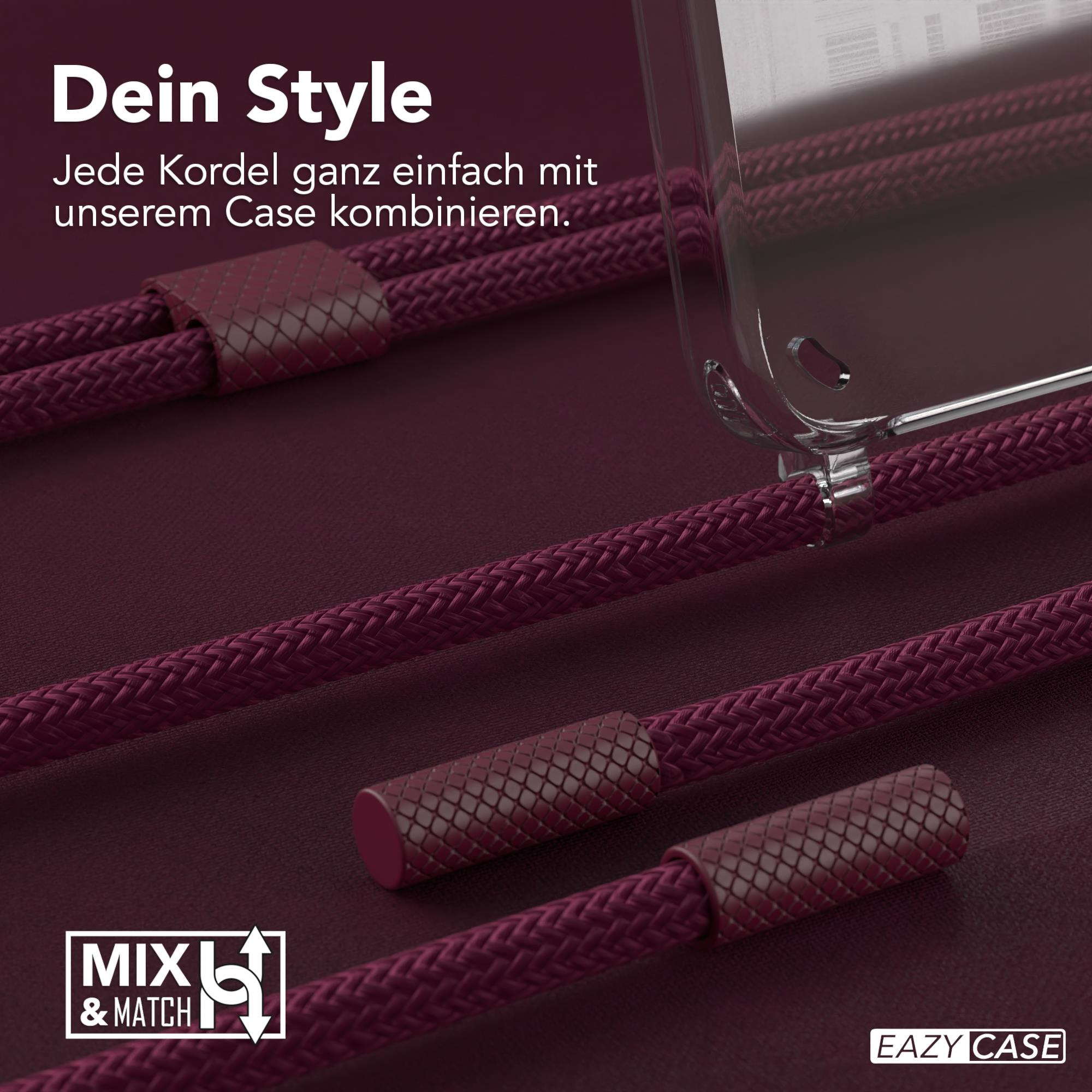 Nahaufnahme einer Handyhülle mit roter Kordel. Text auf Deutsch. Hintergrund ist dunkelrot.