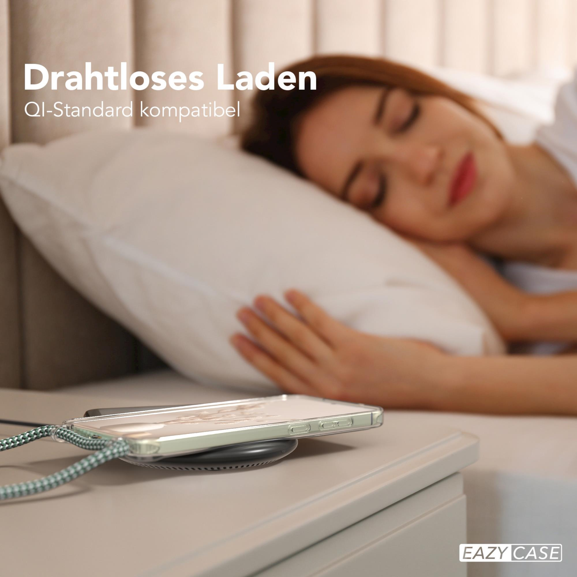 Eine schlafende Frau mit einem Telefon, das auf einem kabellosen Ladegerät auf einem Nachttisch lädt. Der Text 'Drahtloses Laden'.