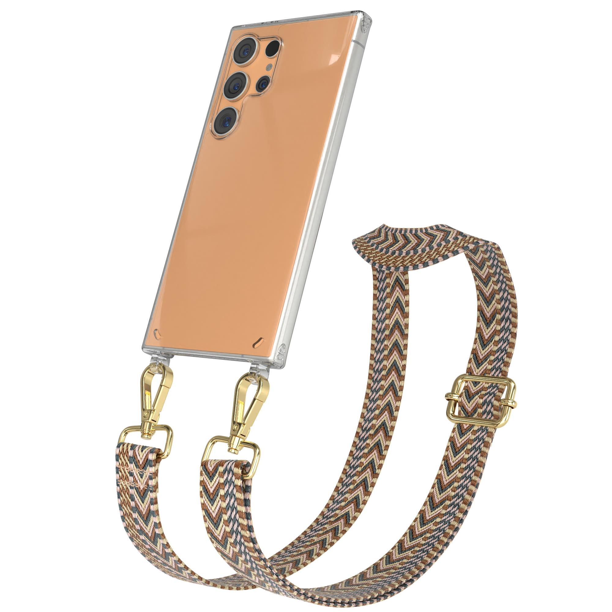 Eine Handyhülle mit einem gemusterten Riemen. Der Riemen ist braun und beige mit goldfarbener Hardware.