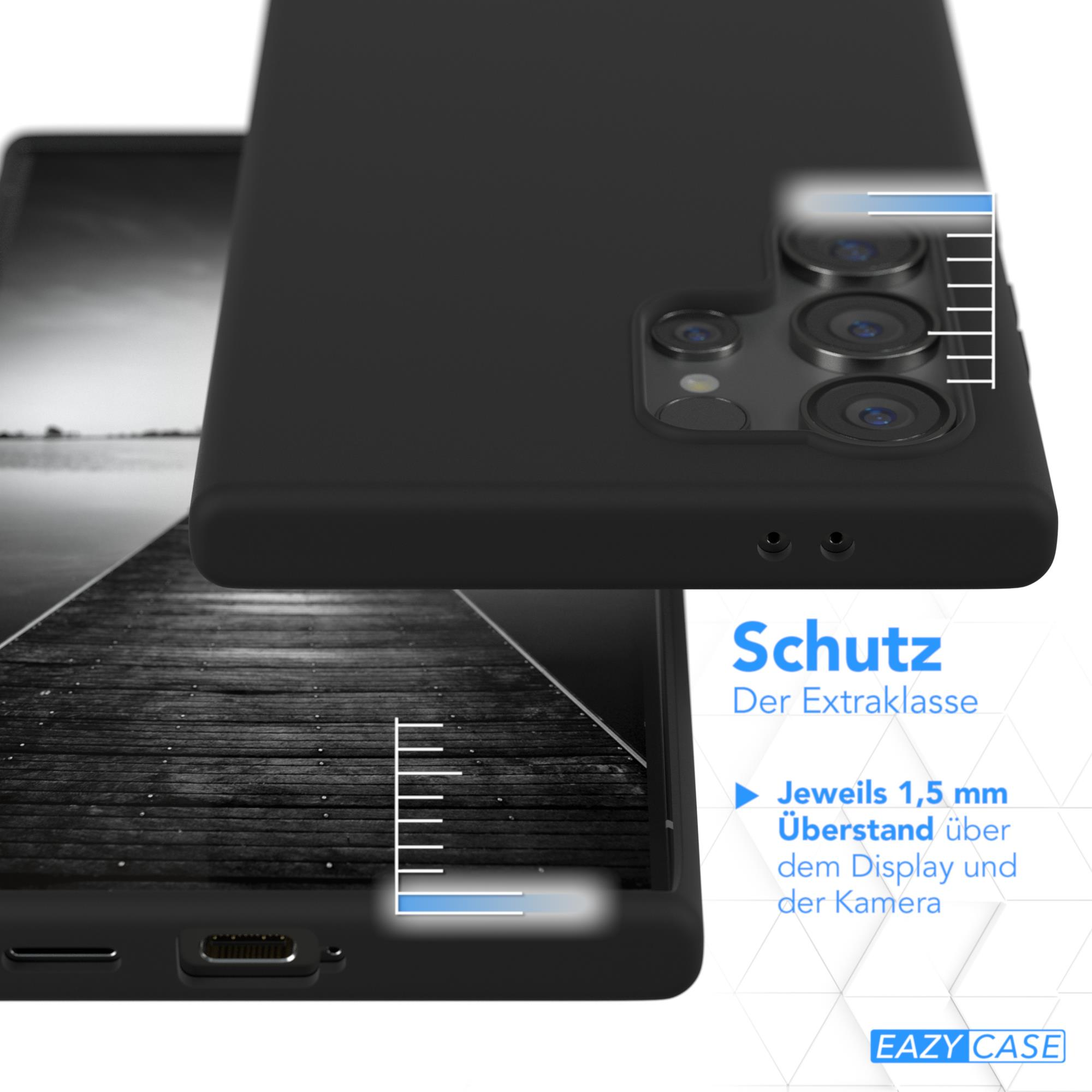 Schwarze Handyhülle mit Telefon, mit Holzgrund. Text und Linien.