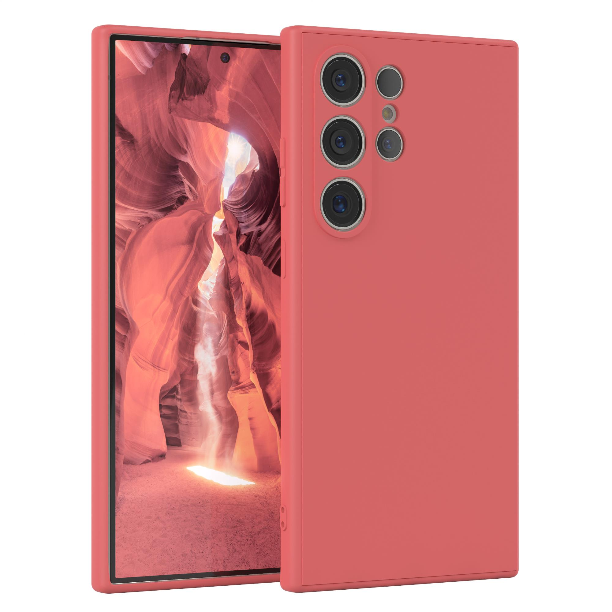 Rotes Telefon mit Hülle. Der Bildschirm zeigt eine Schluchtenlandschaft.