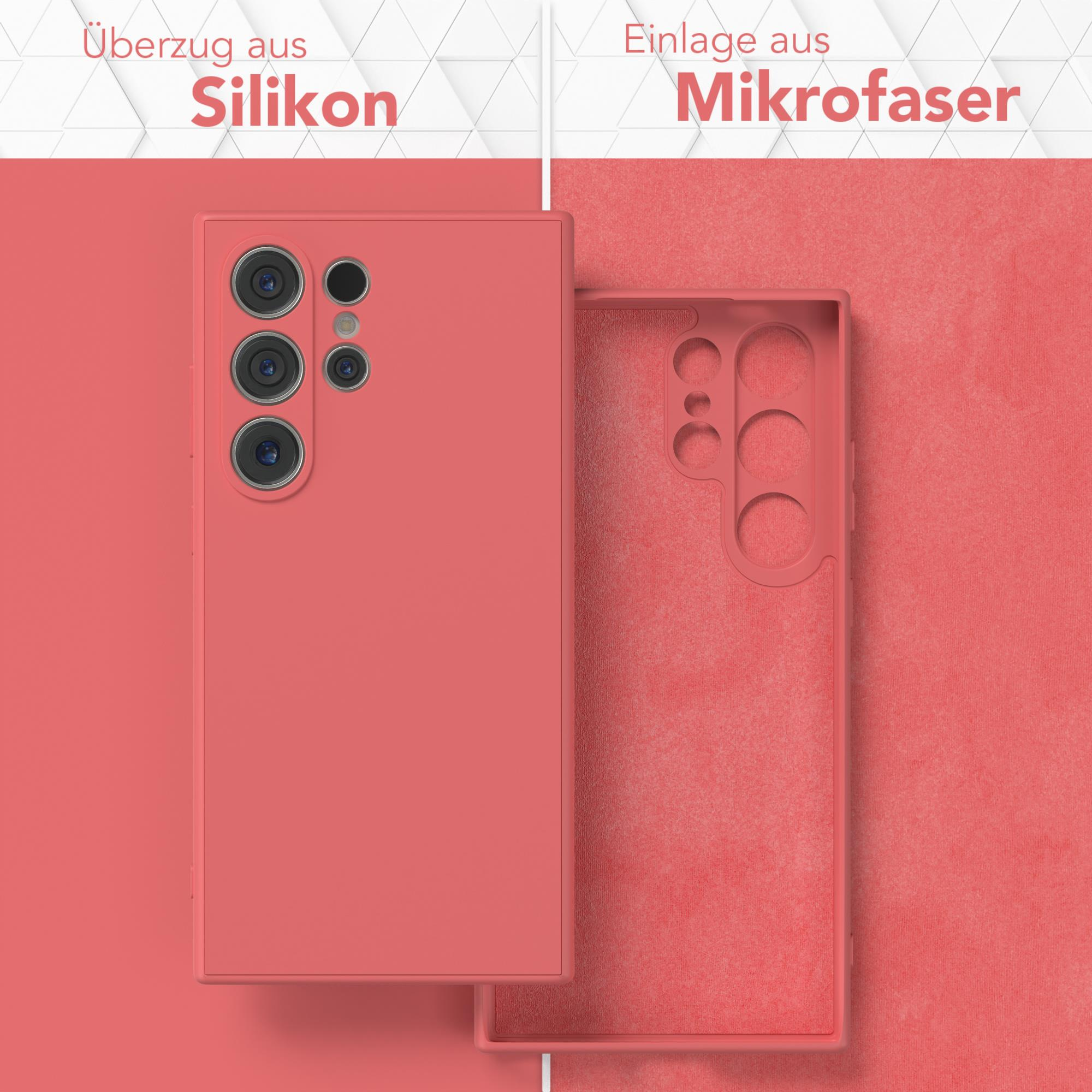 Eine korallenfarbene Handyhülle mit Telefon innen und außen, mit deutschem Text.