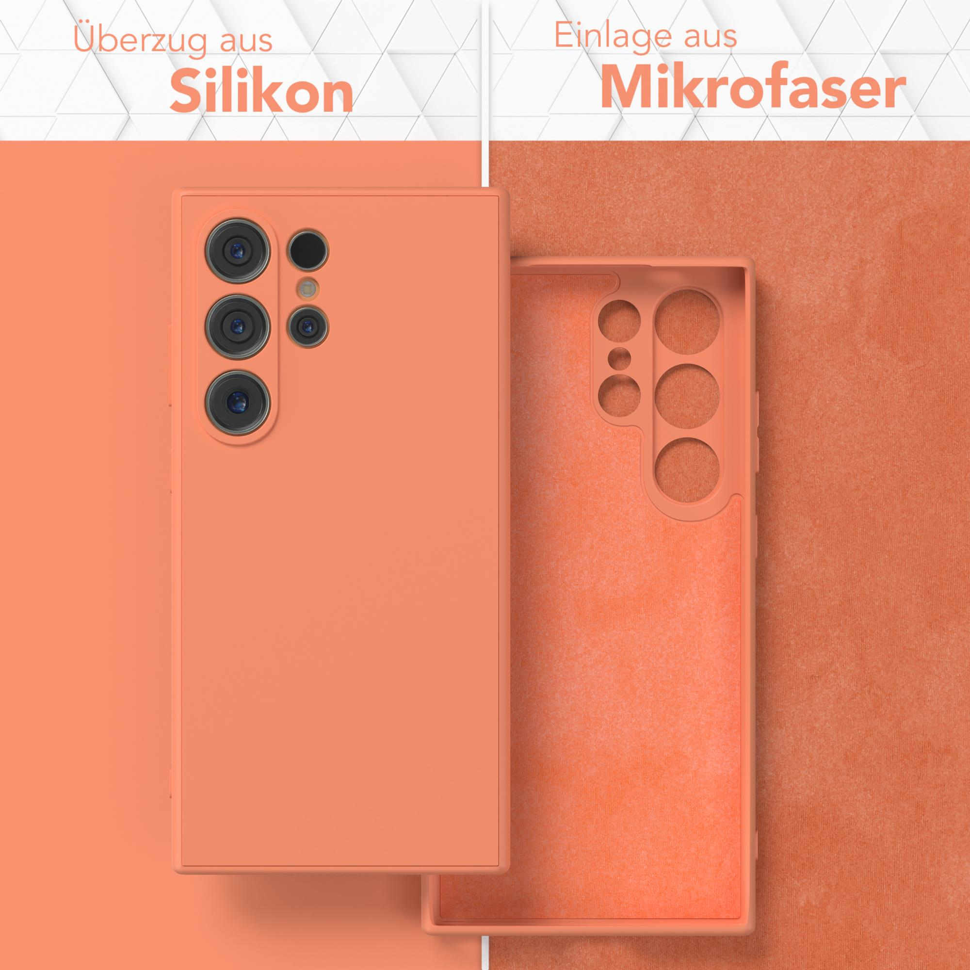 Orangene Handyhülle, geöffnet, um das Innere zu zeigen. Text: Silikonhülle, Mikrofaser-Einsatz.