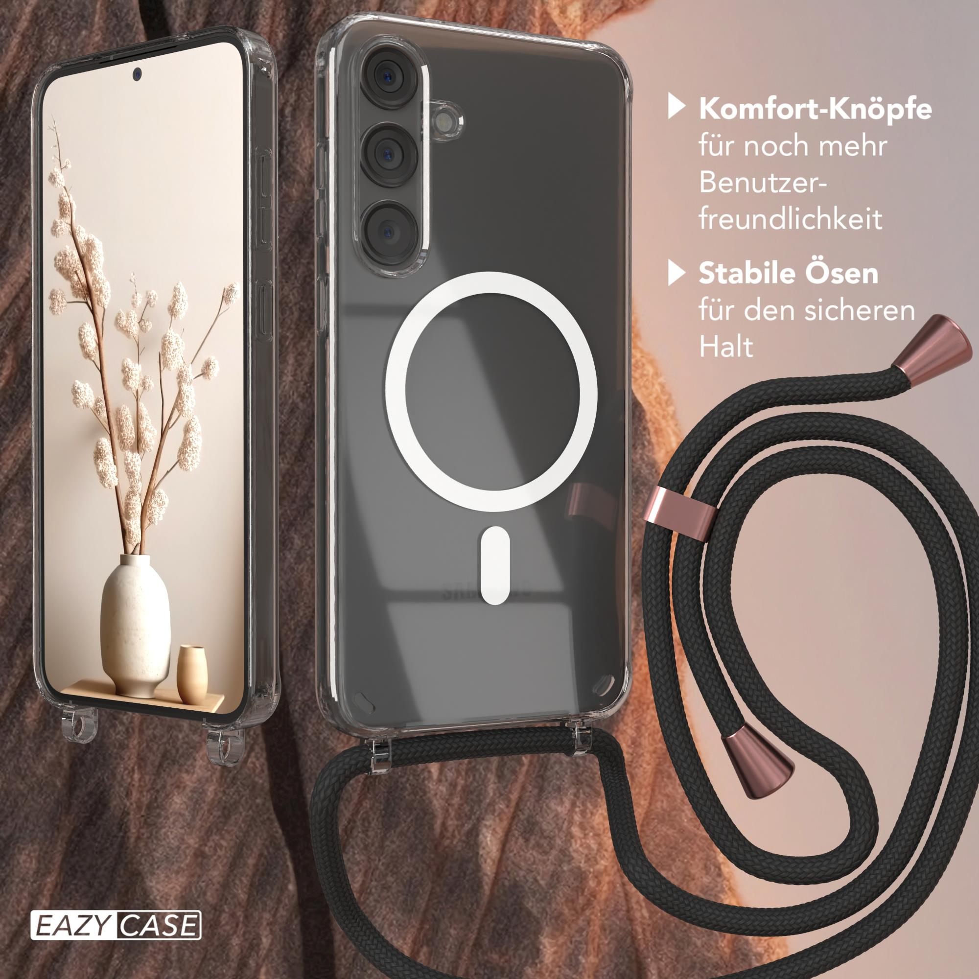 Zwei Frauen mit einem Telefon, schauen auf das Telefon, mit Sonnenuntergang im Hintergrund.
