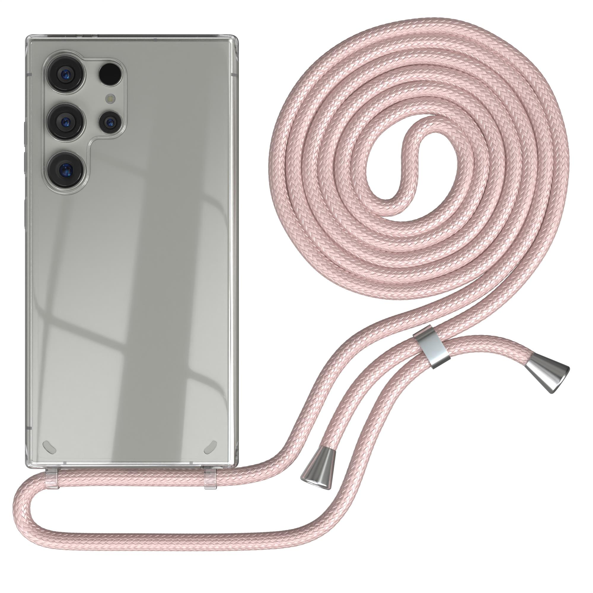 Silbernes Telefon mit pinkfarbener Handykette. Die Kette ist aufgerollt und hat silberne Akzente an den Enden.