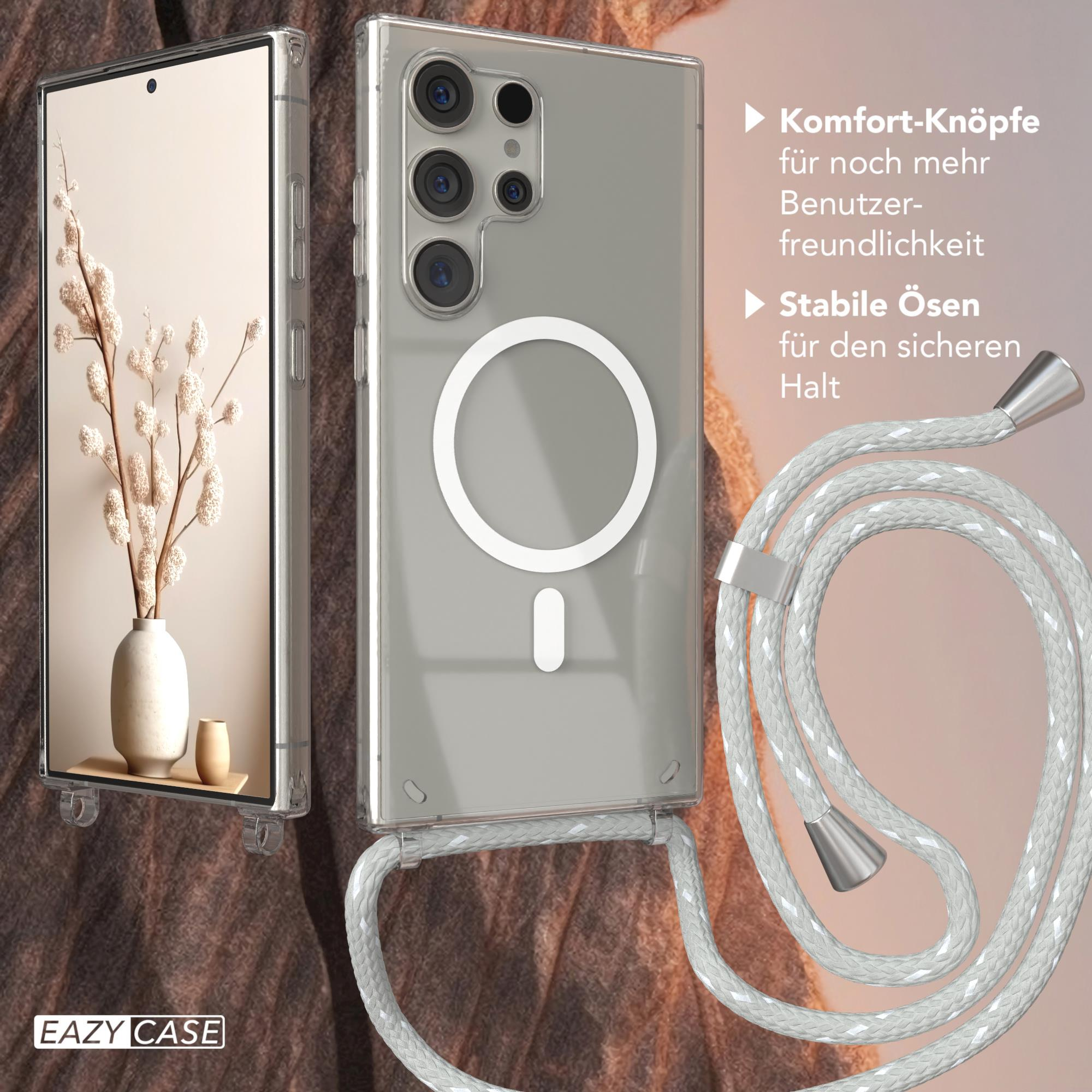 Transparente Handyhülle mit weißem Kordelband. Die Hülle hält ein Telefon mit einer Vase mit Blumen.