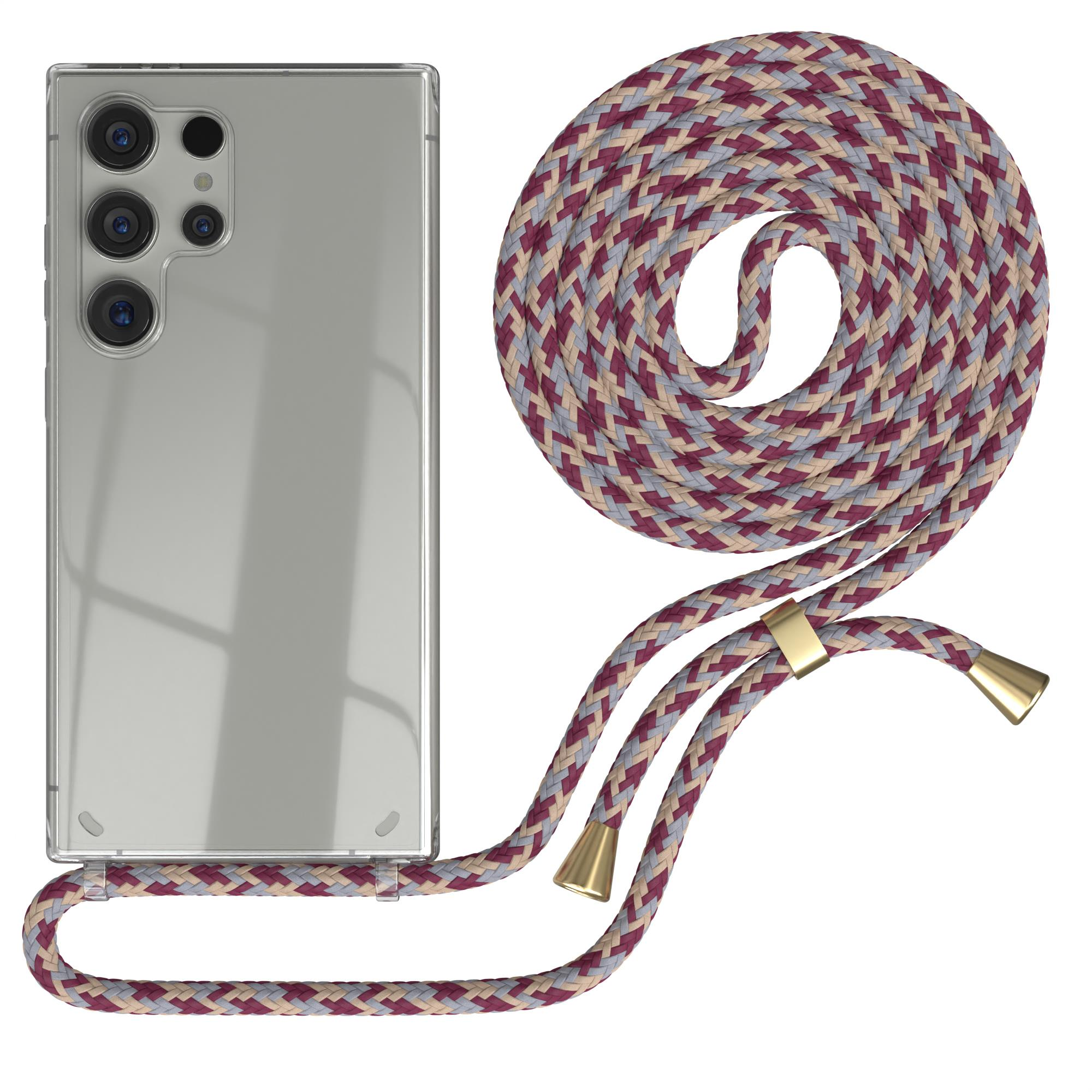Silbernes Telefon mit transparenter Hülle und geflochtenem, mehrfarbigem Riemen. Der Riemen ist befestigt.