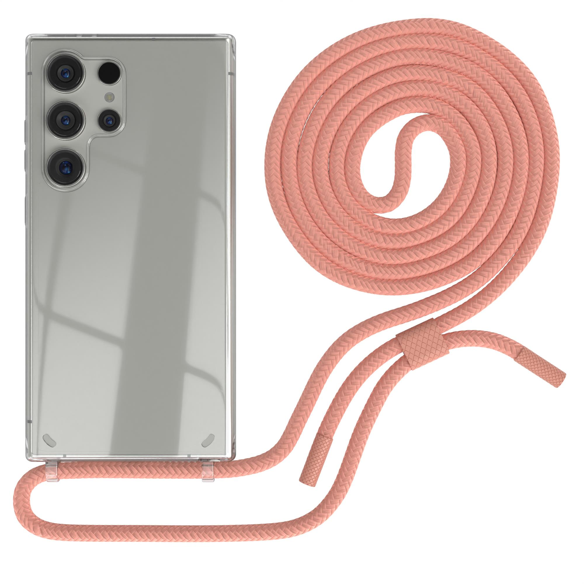 Eine transparente Handyhülle mit einem rosa geflochtenen Riemen. Der Riemen ist aufgerollt und hat eine Schlaufe zum Aufhängen.
