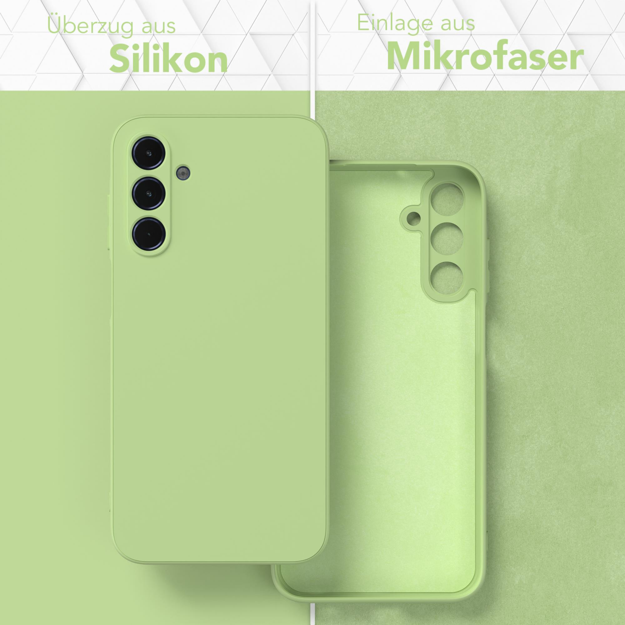 Zwei Handyhüllen, grün, zeigen Silikon außen und Mikrofaser innen. Text weist auf die Materialien hin.