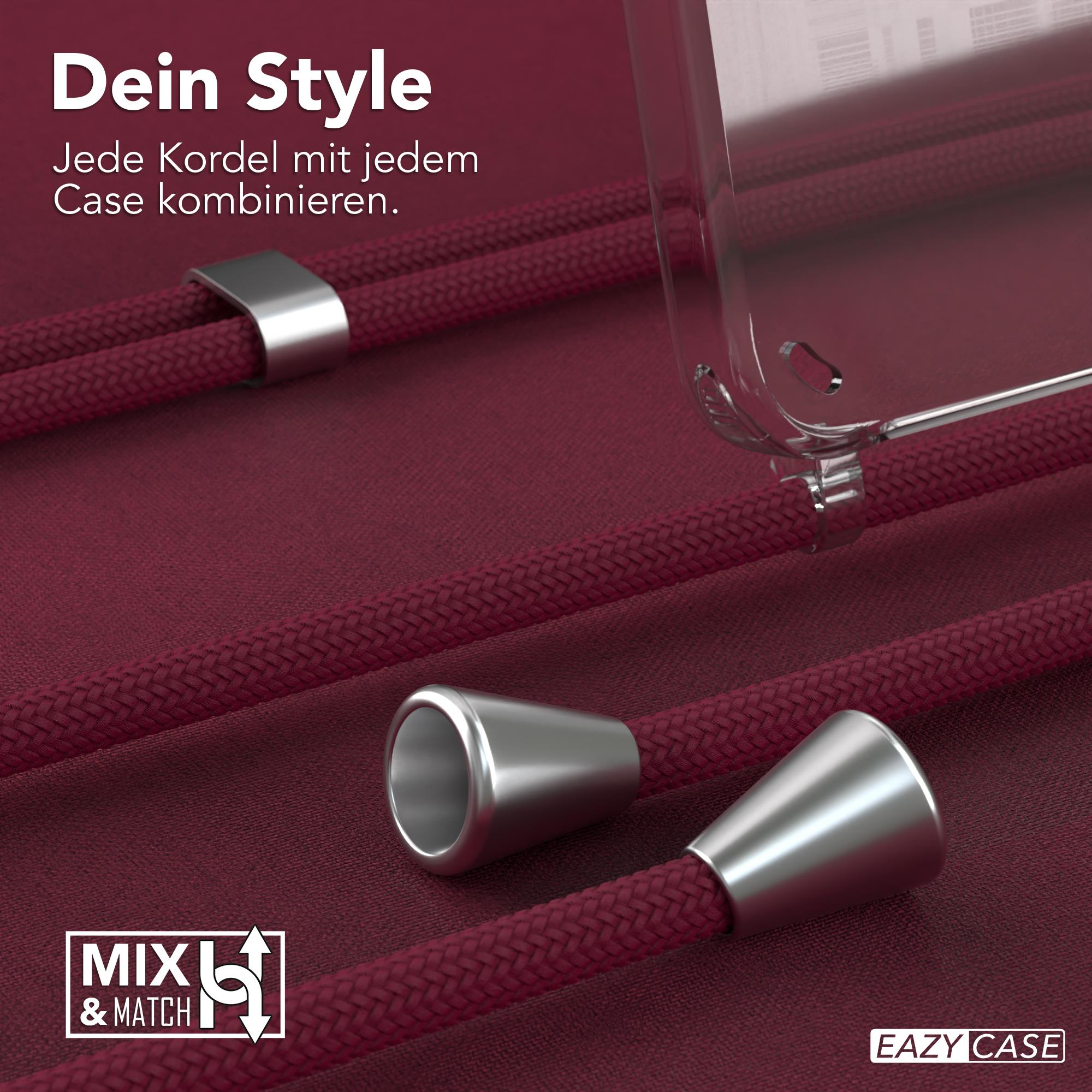 Nahaufnahme von rotem Handykabel, Metallteilen und transparenter Handyhülle.