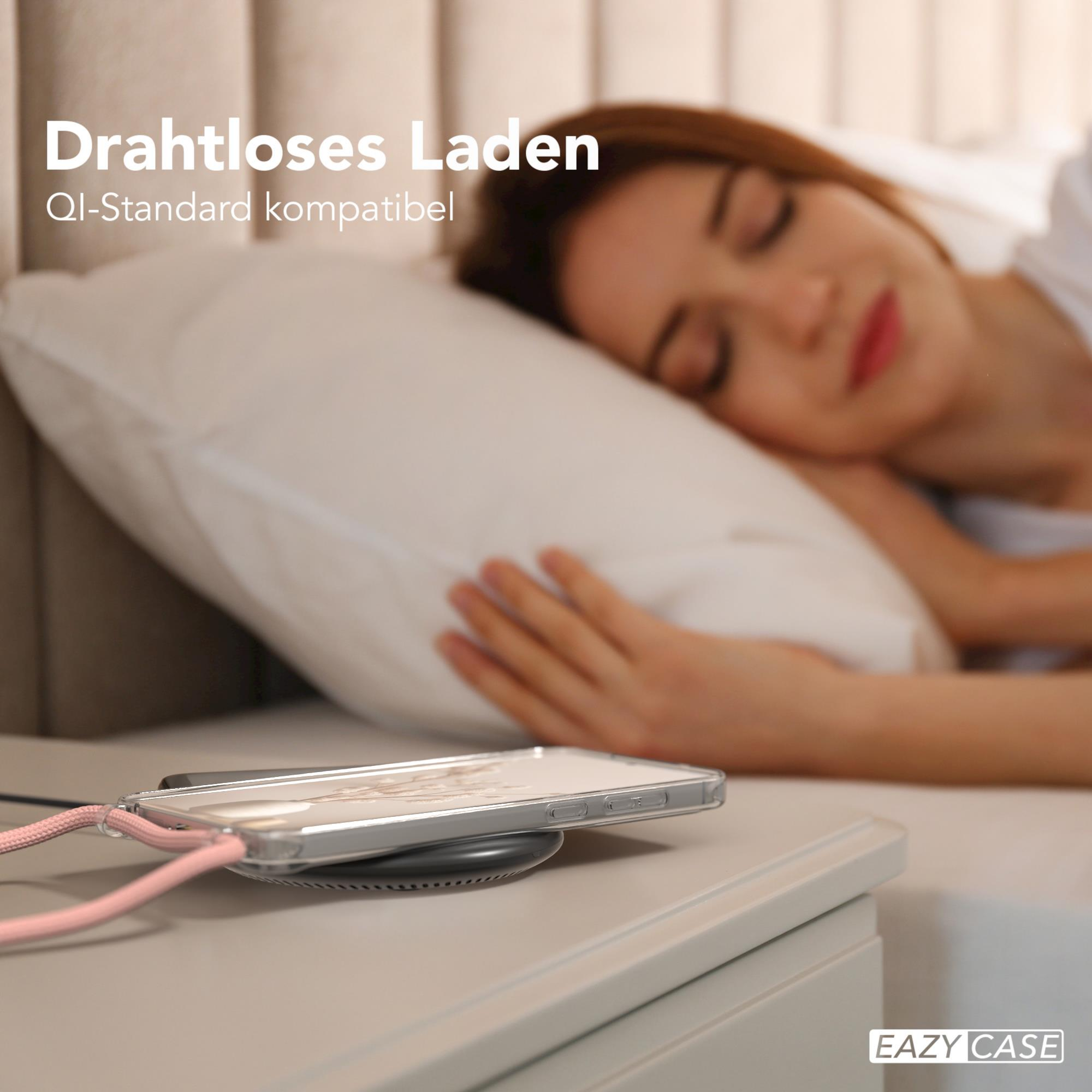 Schlafende Person, Telefon lädt kabellos, weißer Nachttisch, weißer Hintergrund.