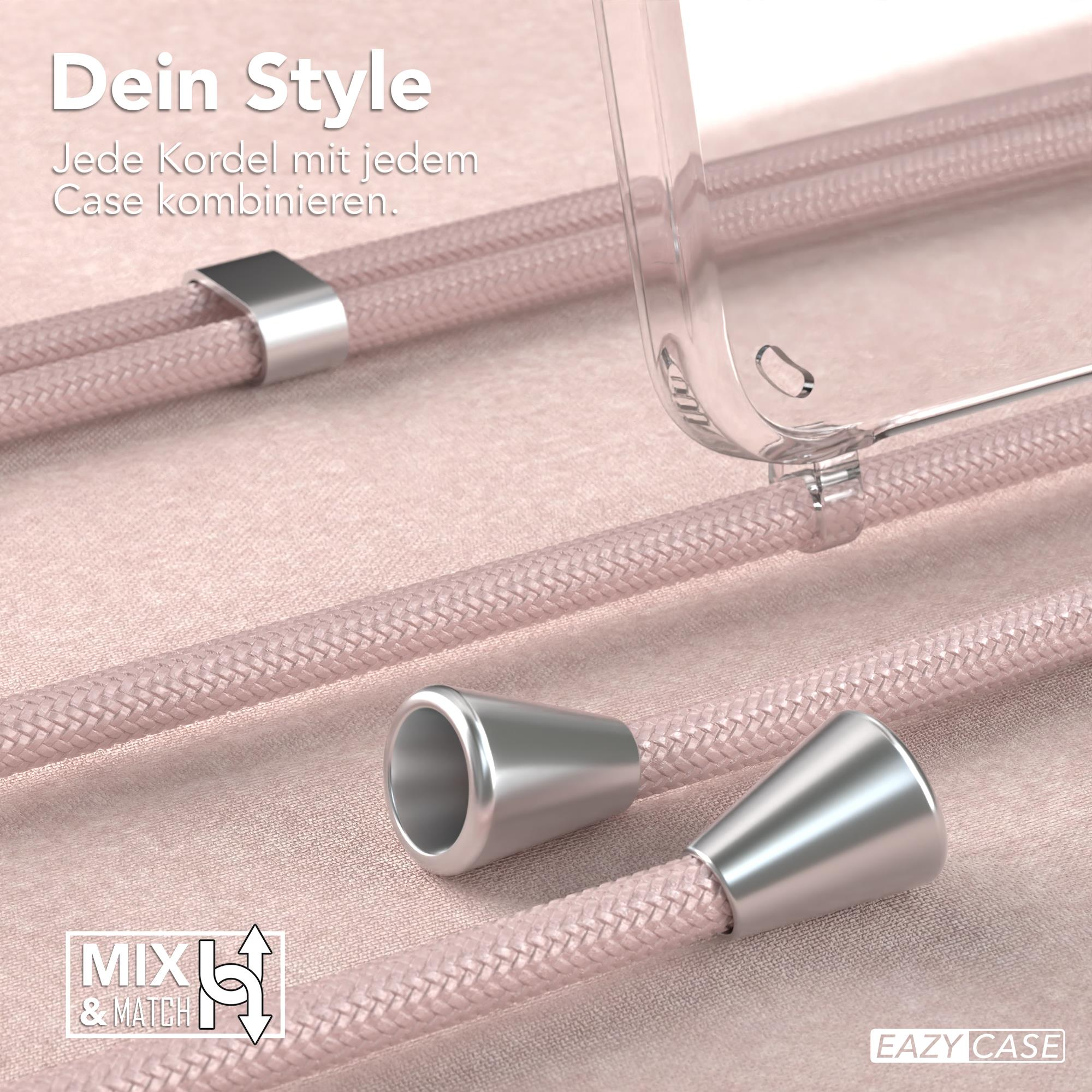 Nahaufnahme einer Handyhülle mit rosa Schnüren. Die Schnüre sind geflochten und mit Silberstücken verbunden.