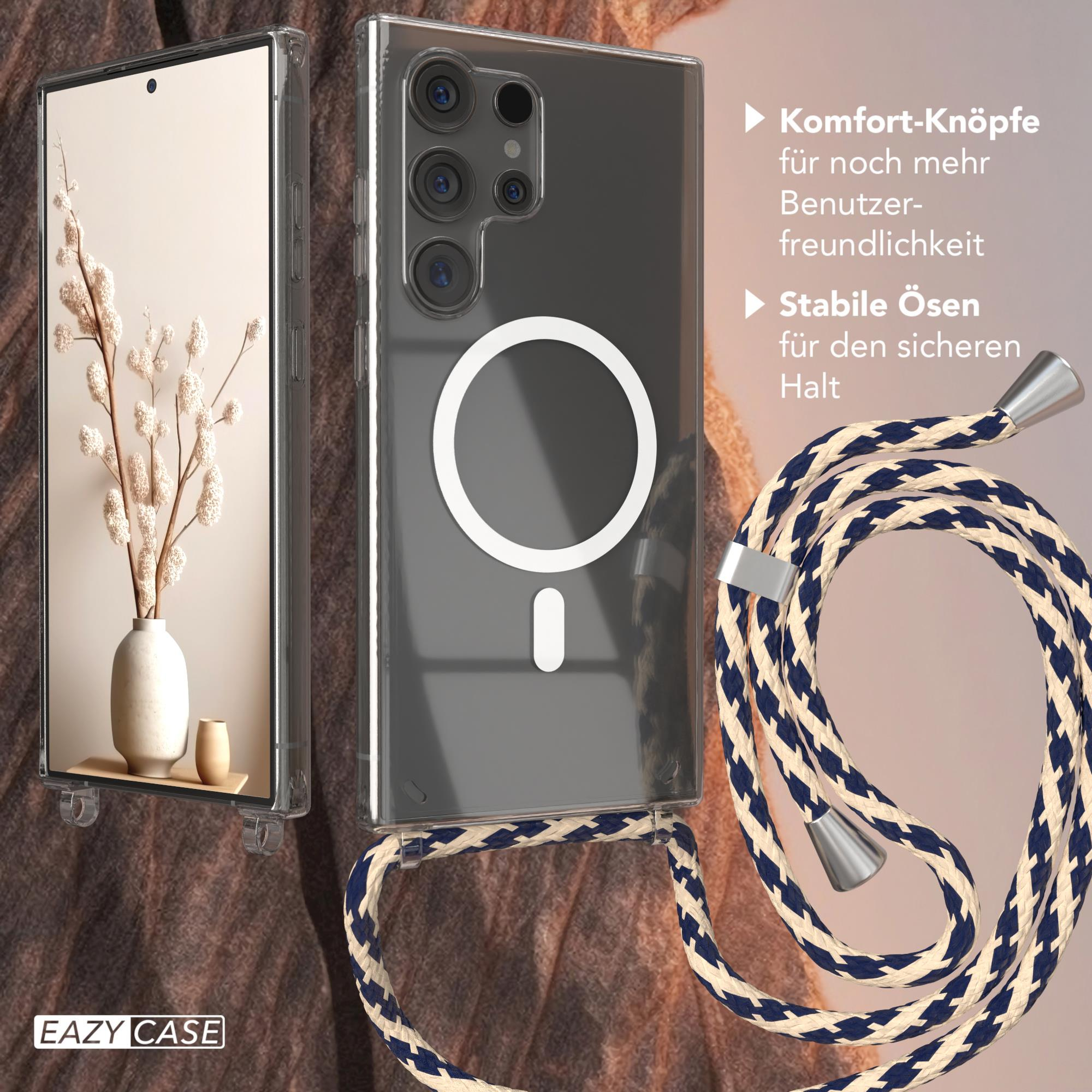 Eine Handyhülle mit Telefon und Lanyard. Eine Vase mit Blumen befindet sich links im Bild.