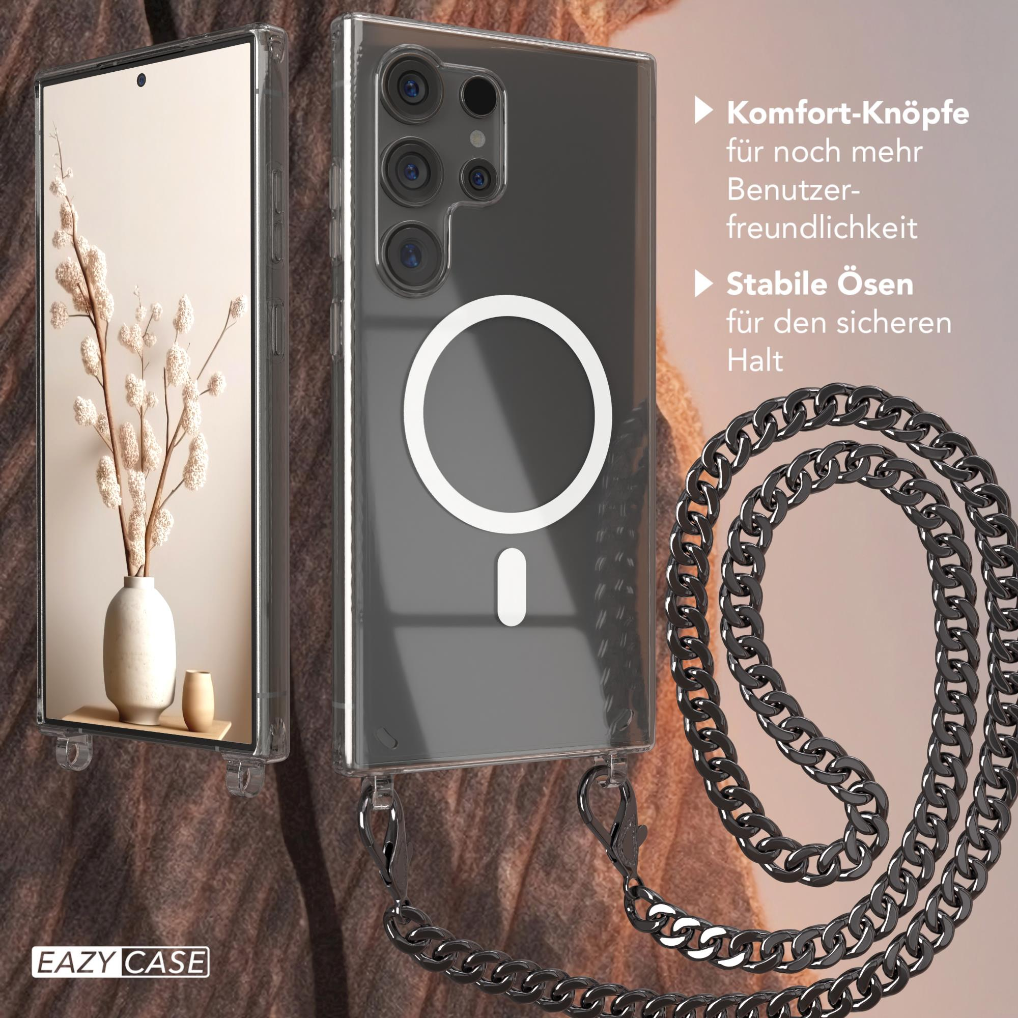 Transparente Handyhülle mit Kette. Ein Telefon ist drin. Die Hülle hat einen weißen Kreis. Der Hintergrund ist beige.