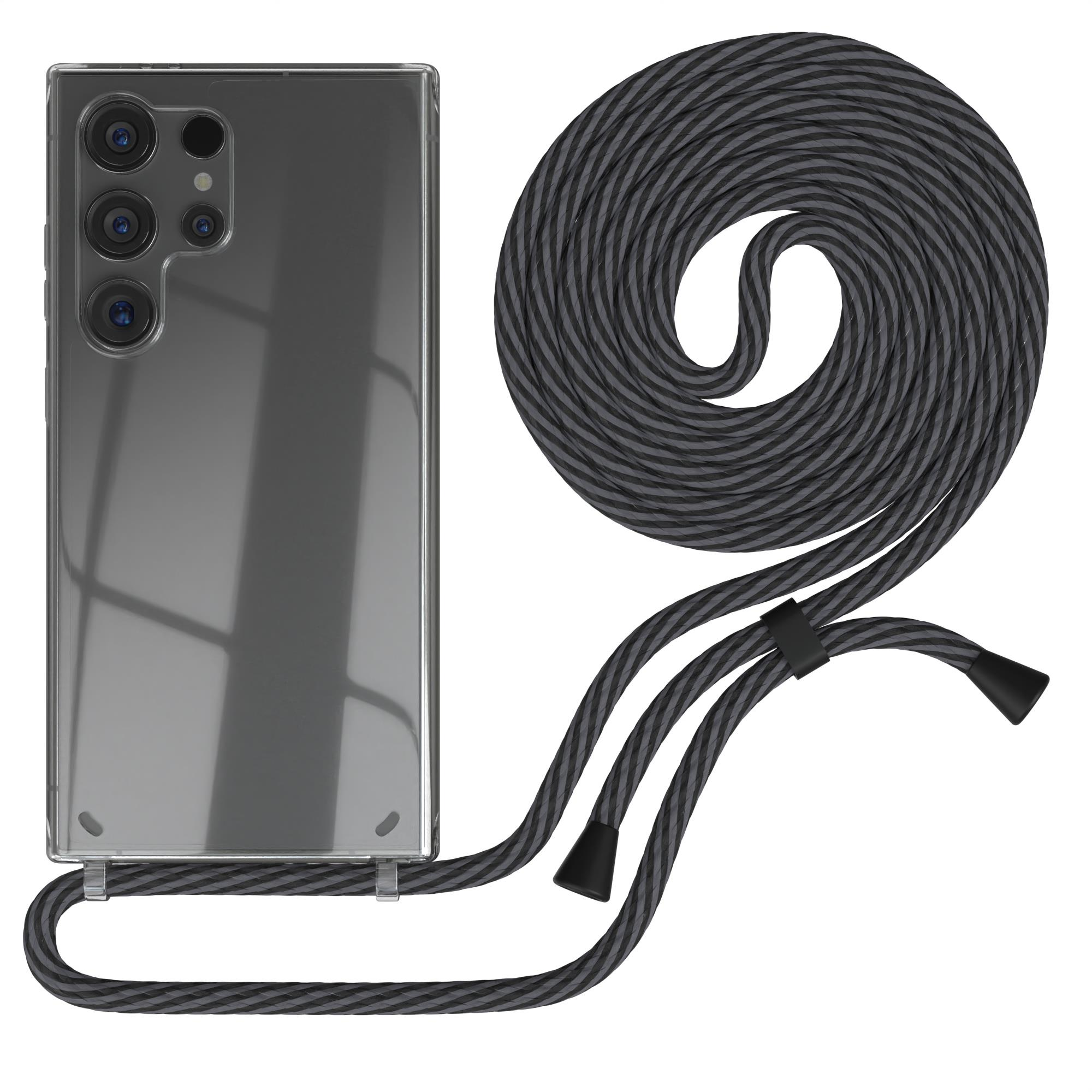 Klares Telefon mit grau-schwarzem Kabel. Schwarze und silberne Aufsätze. Weißer Hintergrund.