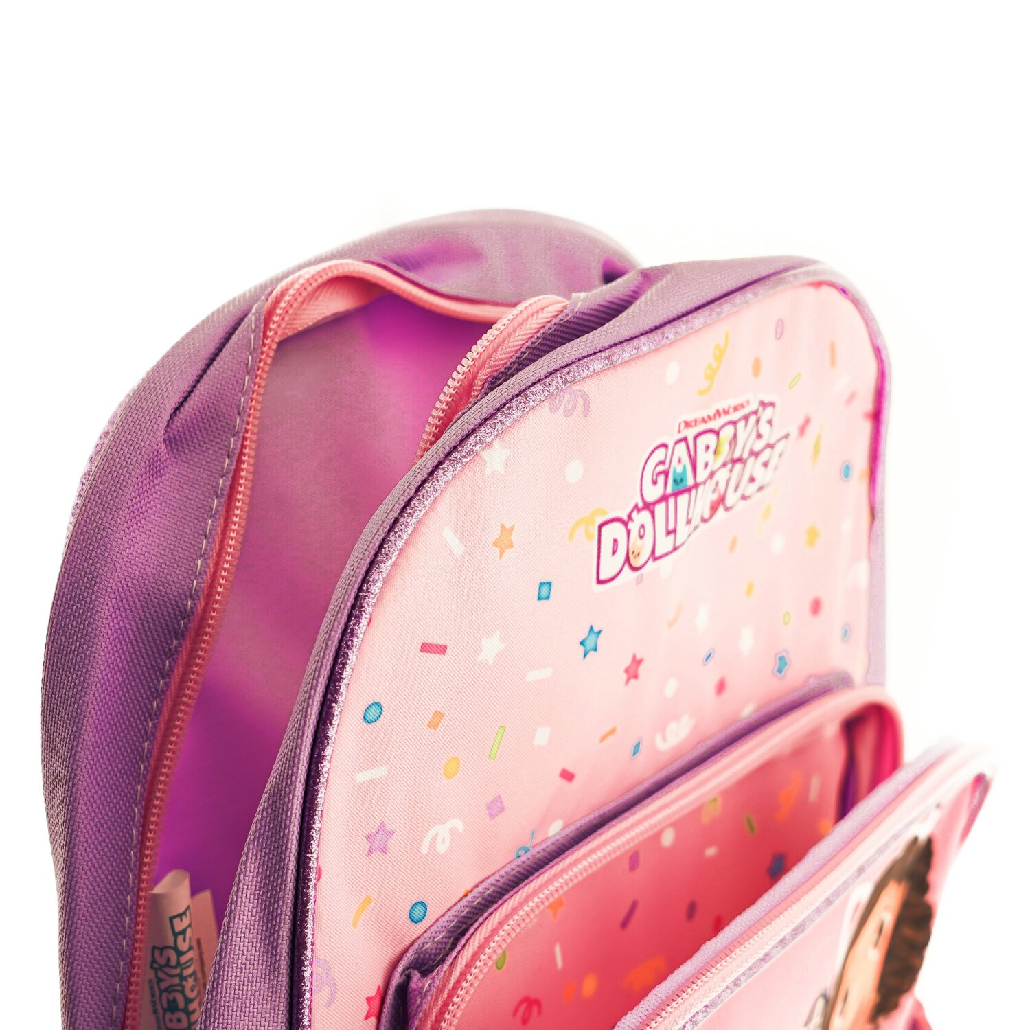 Lila und pinkfarbener Rucksack mit Cartoon-Aufdruck innen, geöffnet und leer.