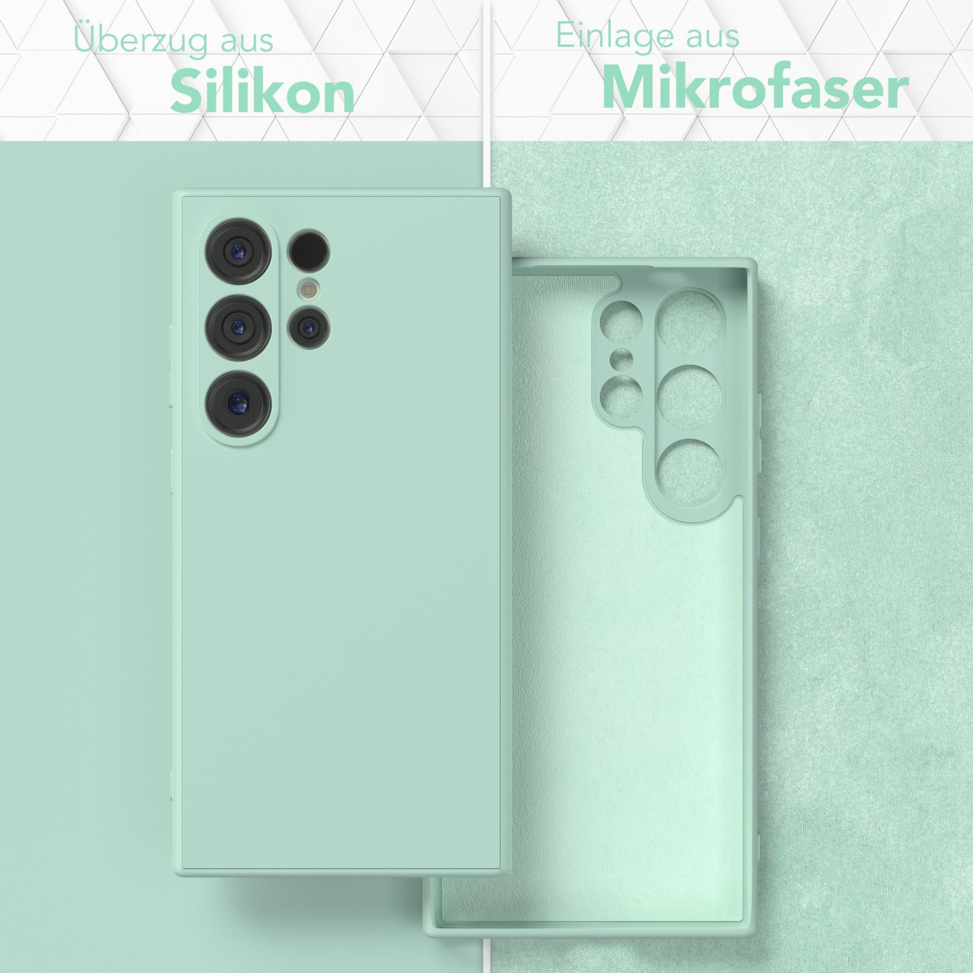 Zwei Handyhüllen, eine mit Handy, hellgrüne Hülle mit grünem Hintergrund.