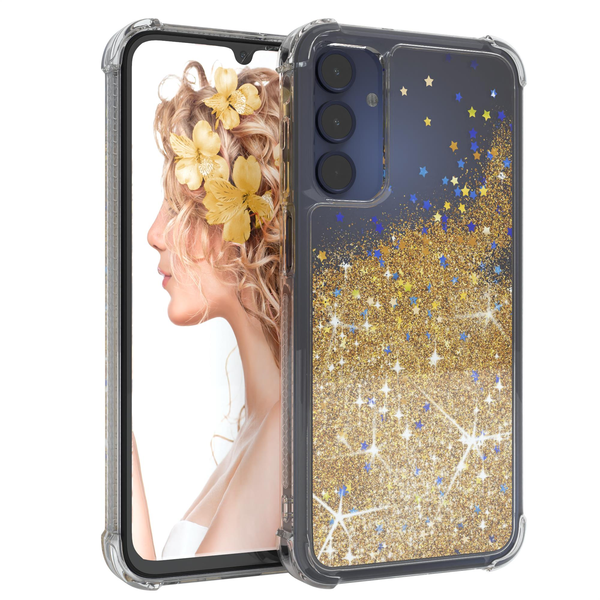 Telefon in Hülle mit goldenem Glitzer und Sternen. Der Bildschirm zeigt Frau mit gelben Blumen.