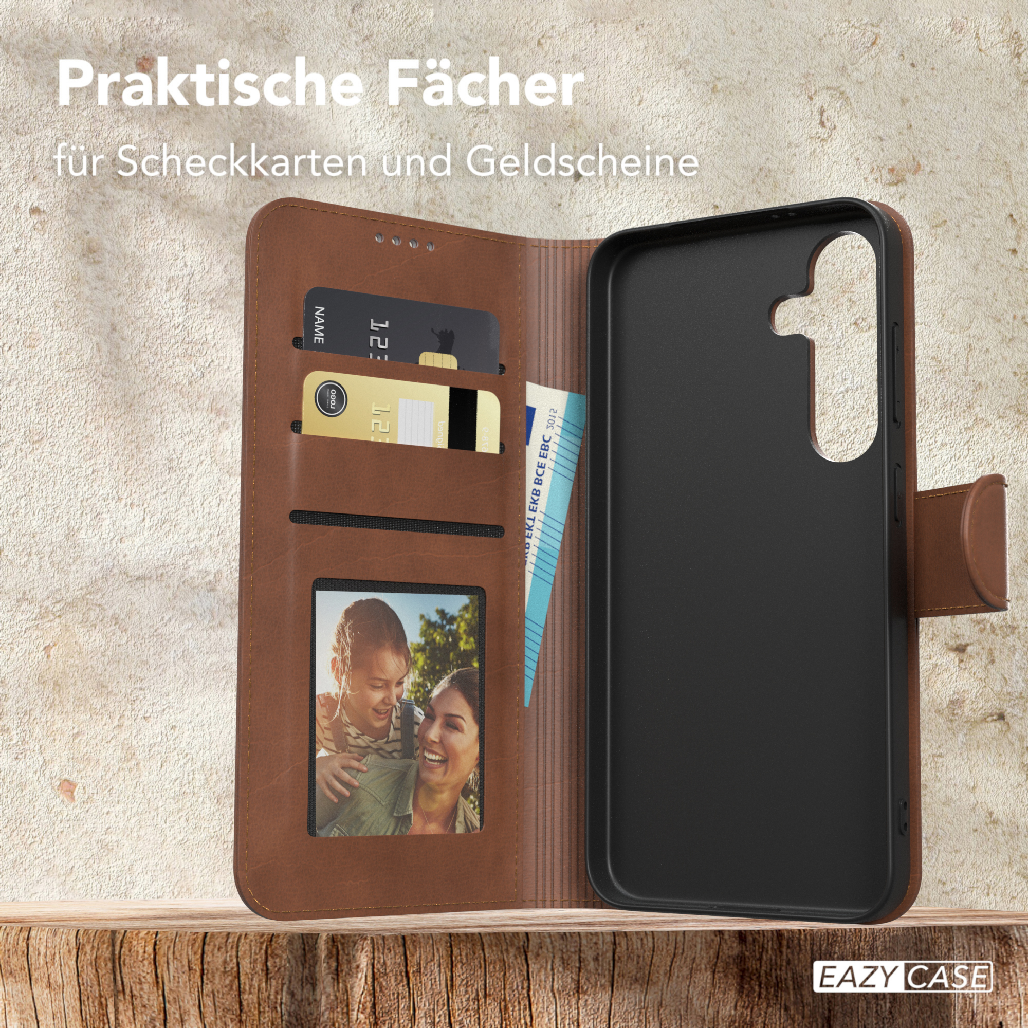 Geöffnete Leder-Handyhülle mit Karten und Foto. Innen eine schwarze Handyhülle.