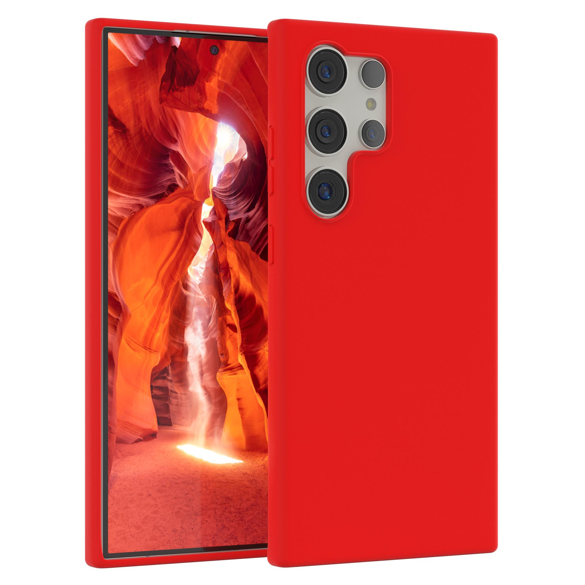 Rote Handyhülle mit Handy, das einen Canyon zeigt. Das Handy hat Kameralinsen. Hintergrund ist eine Schluchtszene.