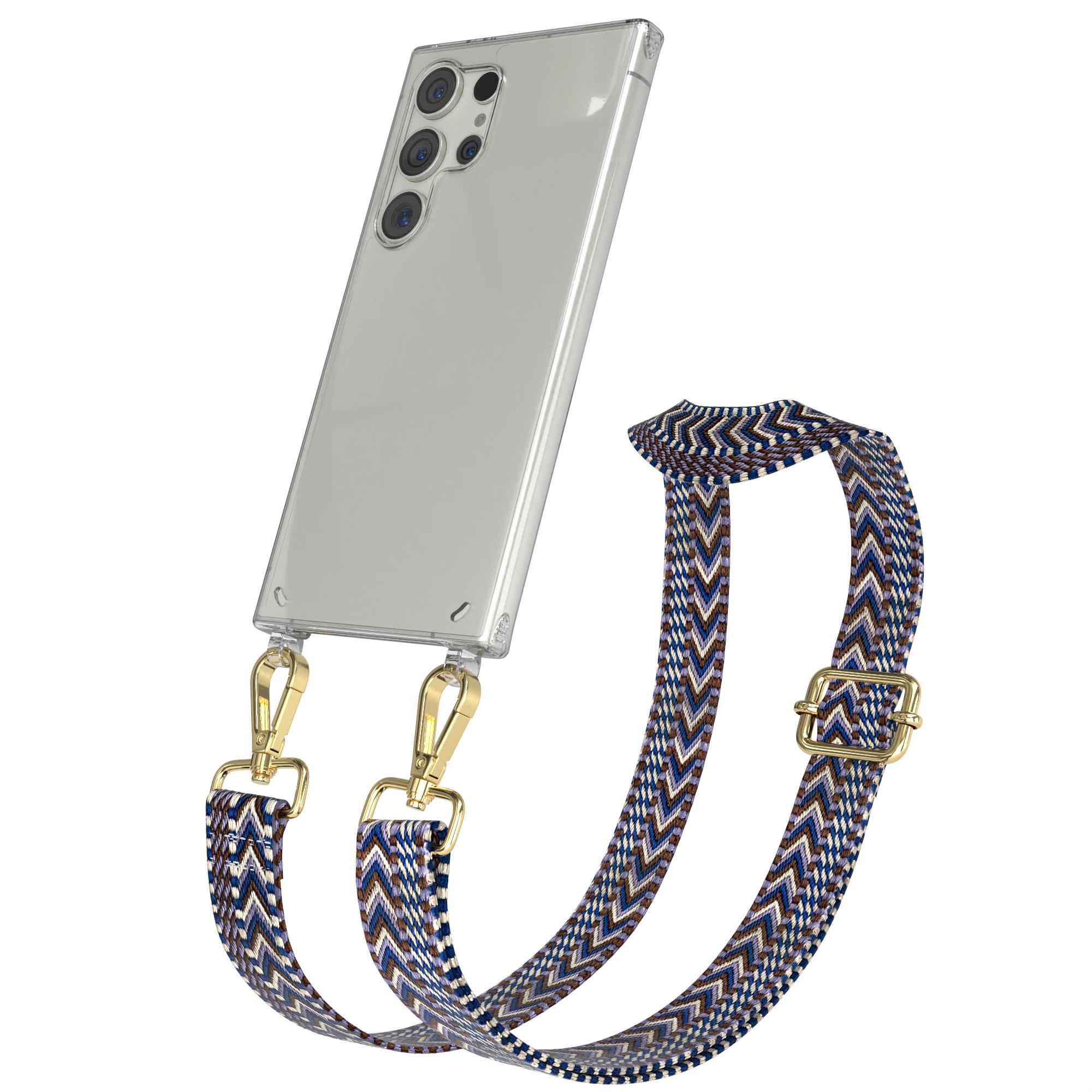 Eine transparente Handyhülle mit blau-braunem Trageriemen. Das Telefon ist in der Hülle.