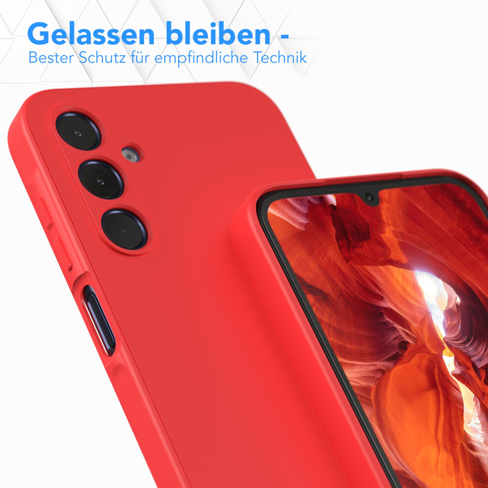 Zwei rote Handyhüllen, eine im Fokus. Der Text lautet 'Gelassen bleiben'. Der Hintergrund ist eine Höhle.