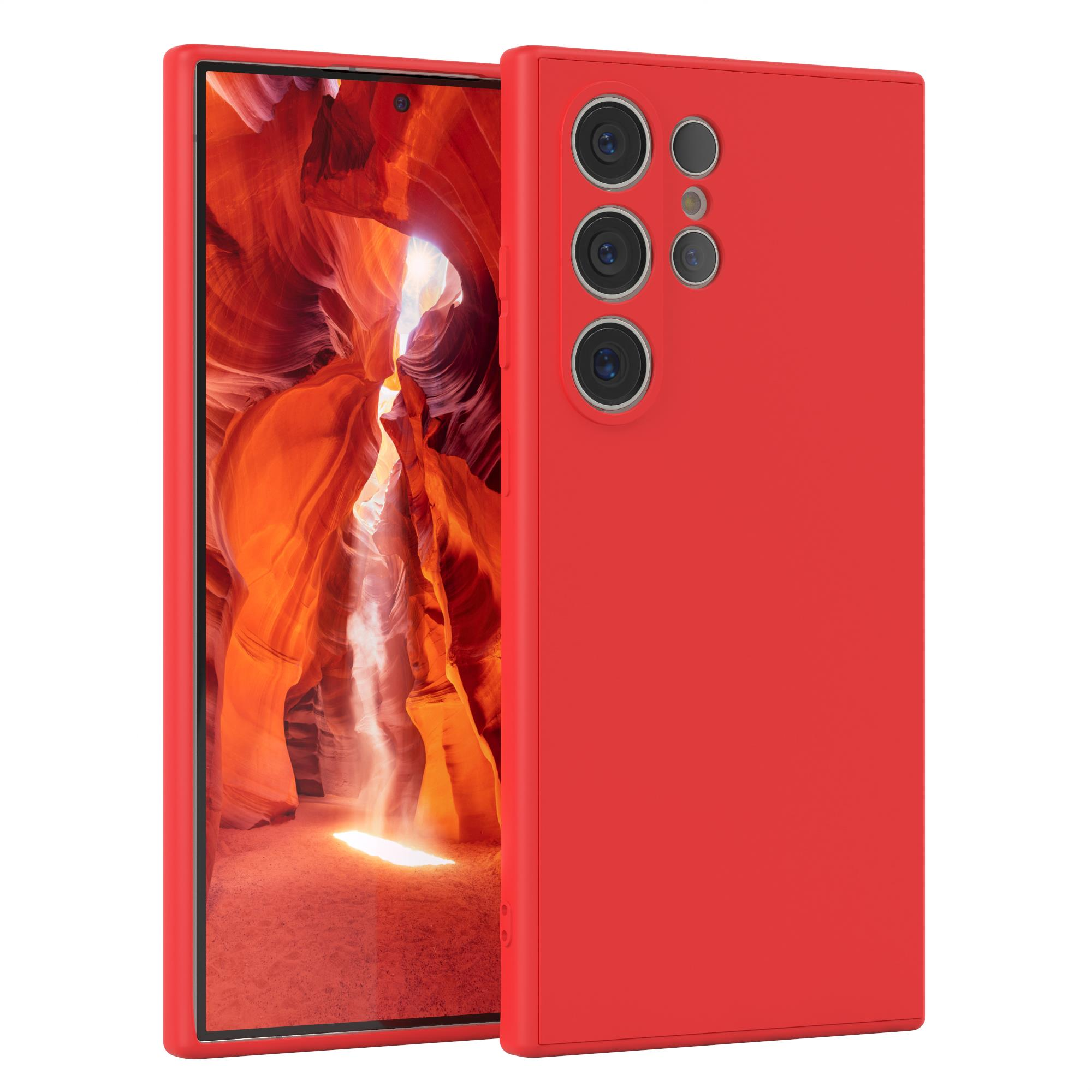 Eine rote Handyhülle mit einem Telefon darin. Das Telefon zeigt ein rotes, strukturiertes Muster.