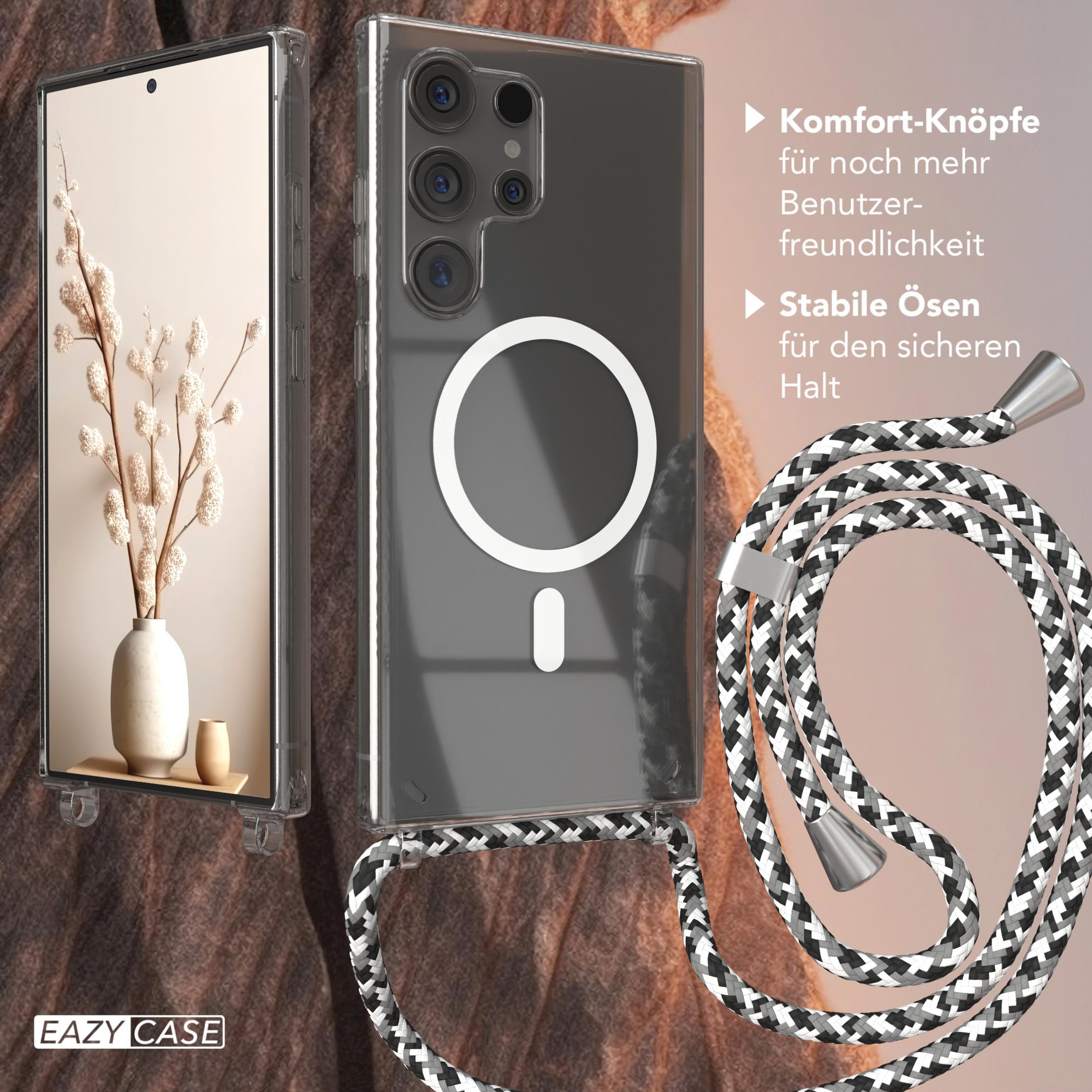 Eine Handyhülle mit Telefon im Inneren. Die Hülle ist transparent mit einem Magnetring und einem gemusterten Riemen.