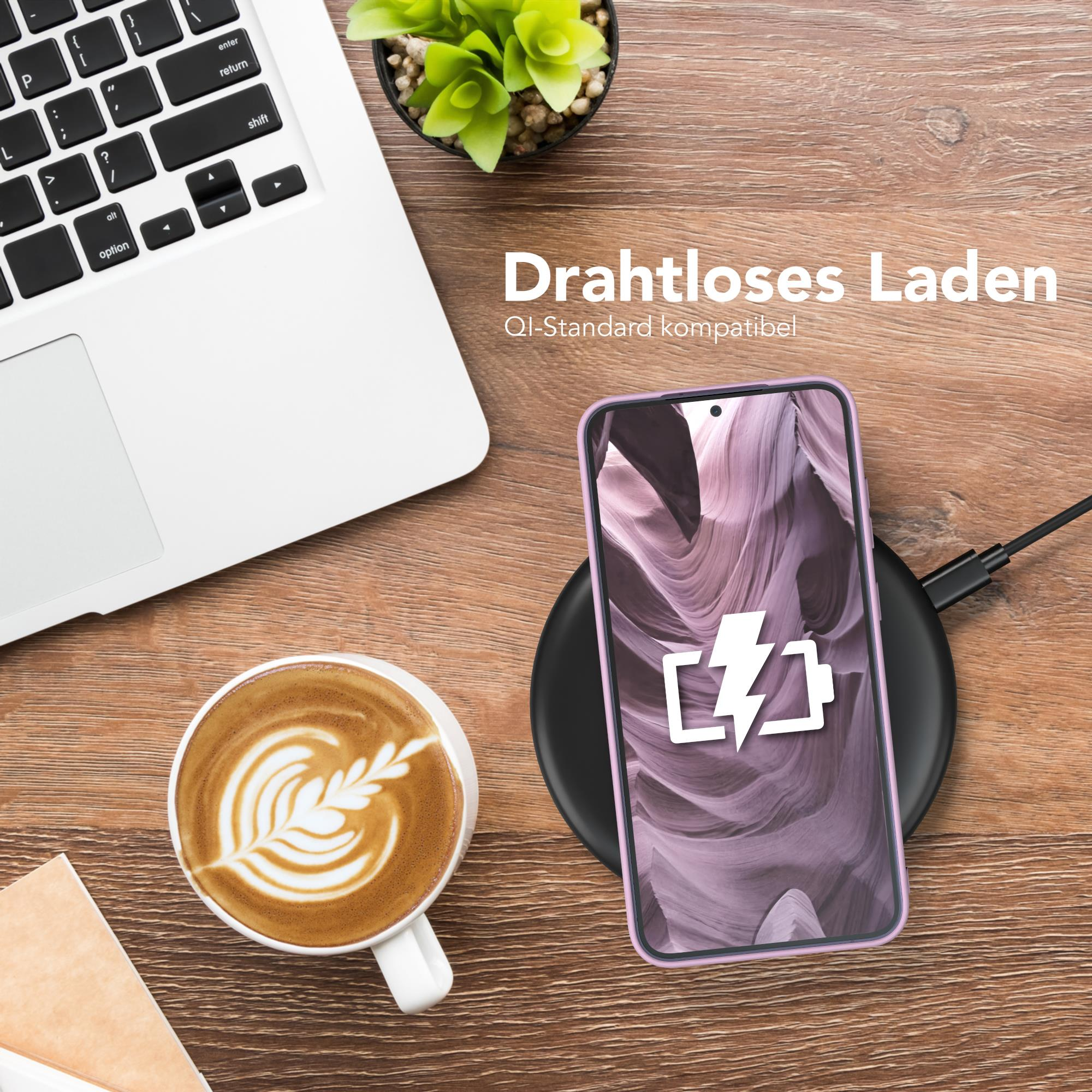 Telefon auf Ladegerät, Kaffee und Laptop. Text lautet 'Drahtloses Laden'.