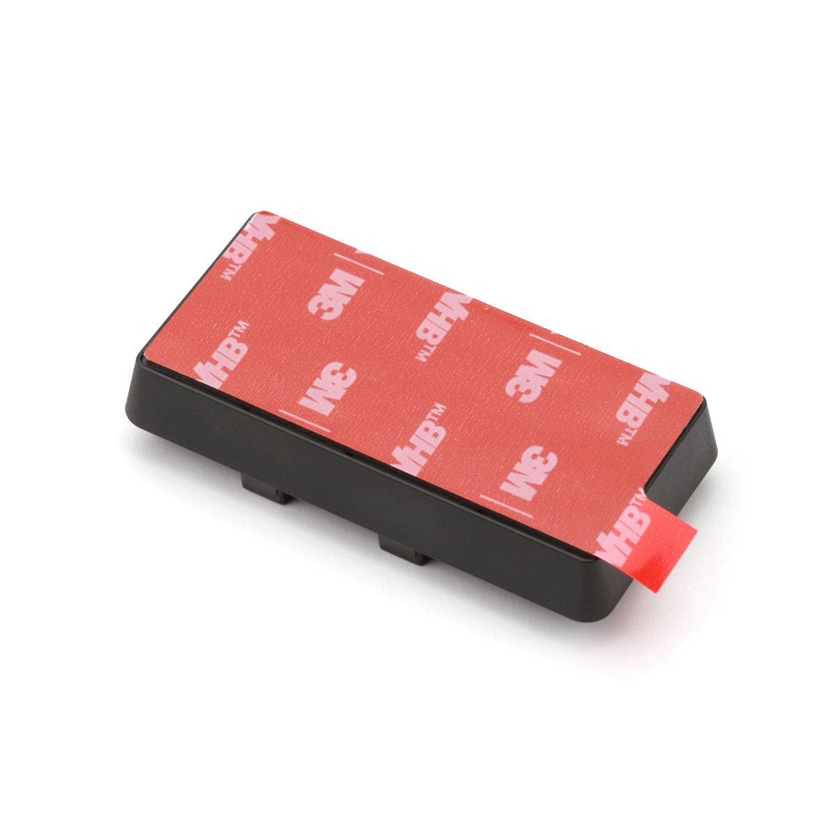 Black mounting base with red tape. The red tape is 3M VHB.