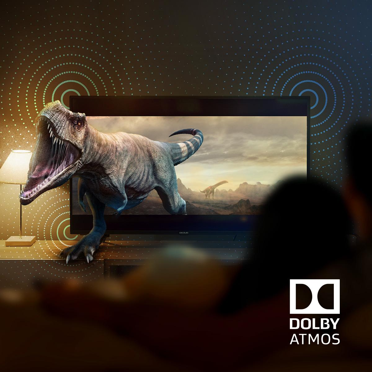 Dinozaur na ekranie telewizora, z logo Dolby Atmos na dole.