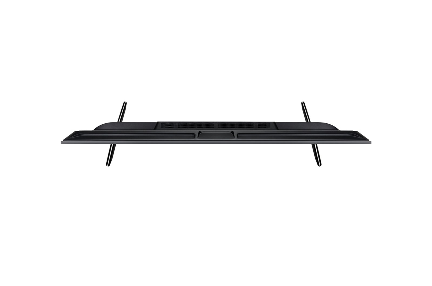 Telewizor z góry, z cienkimi nóżkami i kratką głośnika na dole.