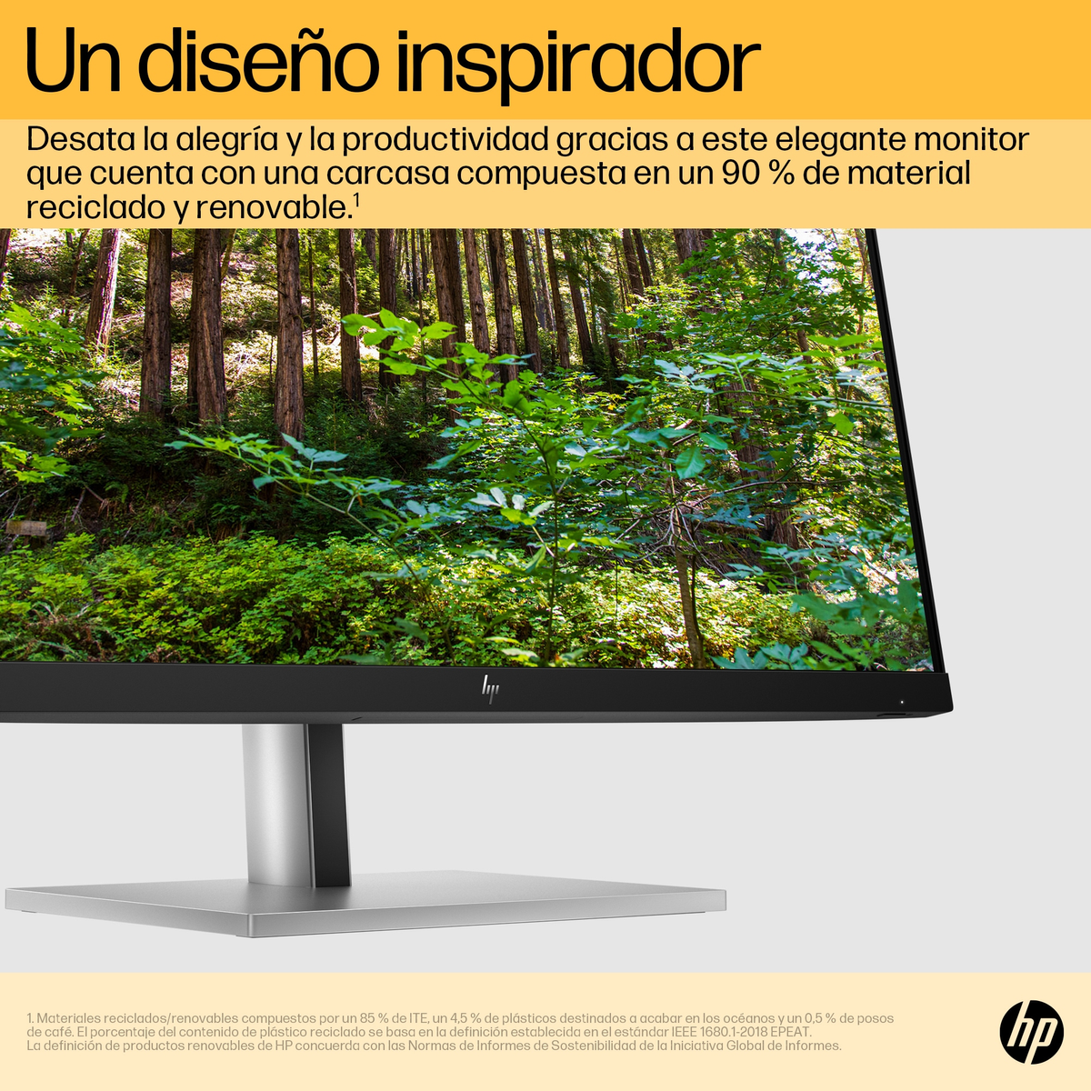 Un monitor de computadora con una imagen de bosque en la pantalla.